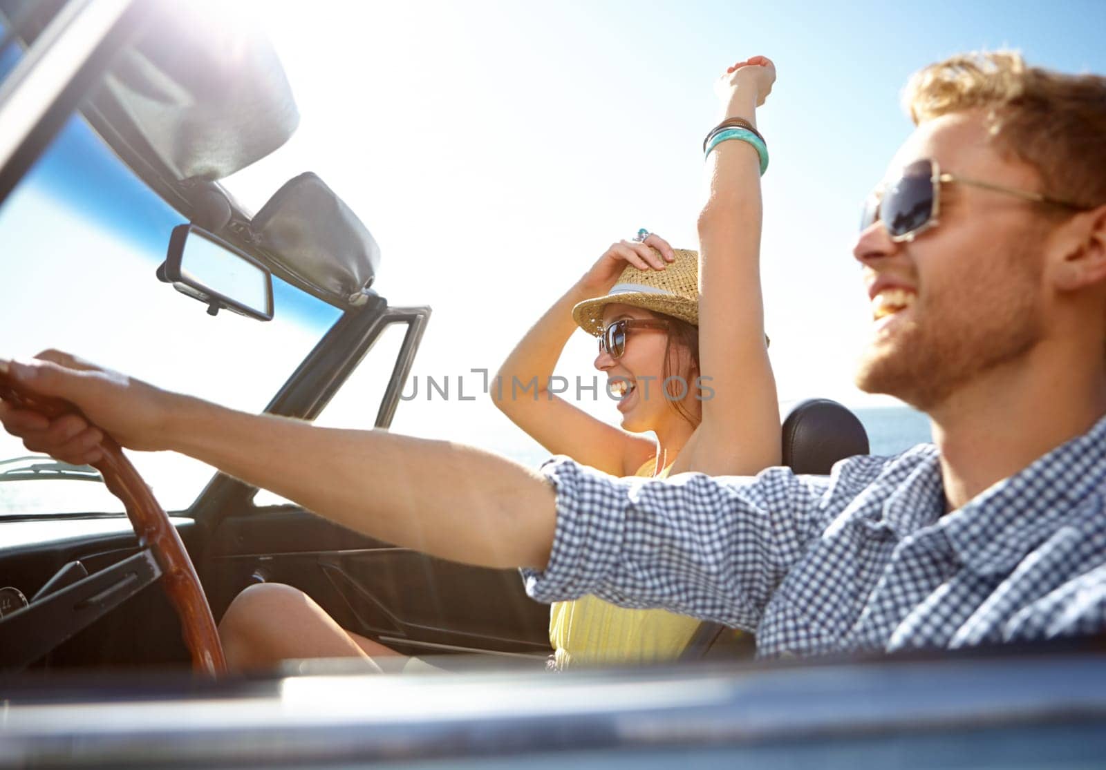 Travel, car road trip and profile couple on bonding holiday adventure, transportation journey or fun summer vacation. Love flare, convertible automobile and happy driver driving on Canada countryside.
