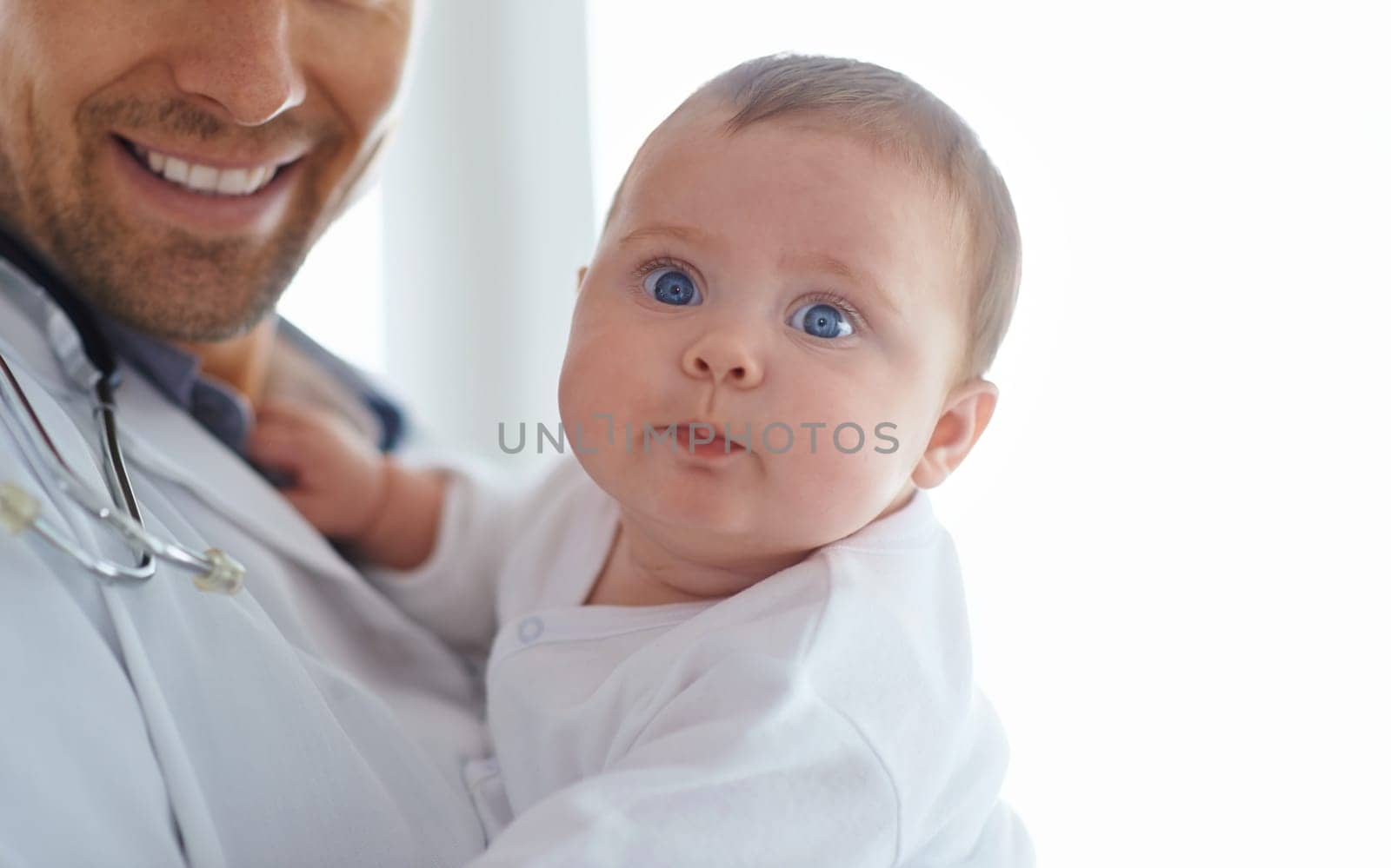 Funny, face and baby with pediatrician in hospital for medical support and growth in portrait. Cute newborn kid, pediatrics doctor and healthcare service, expert consulting and clinic for children by YuriArcurs