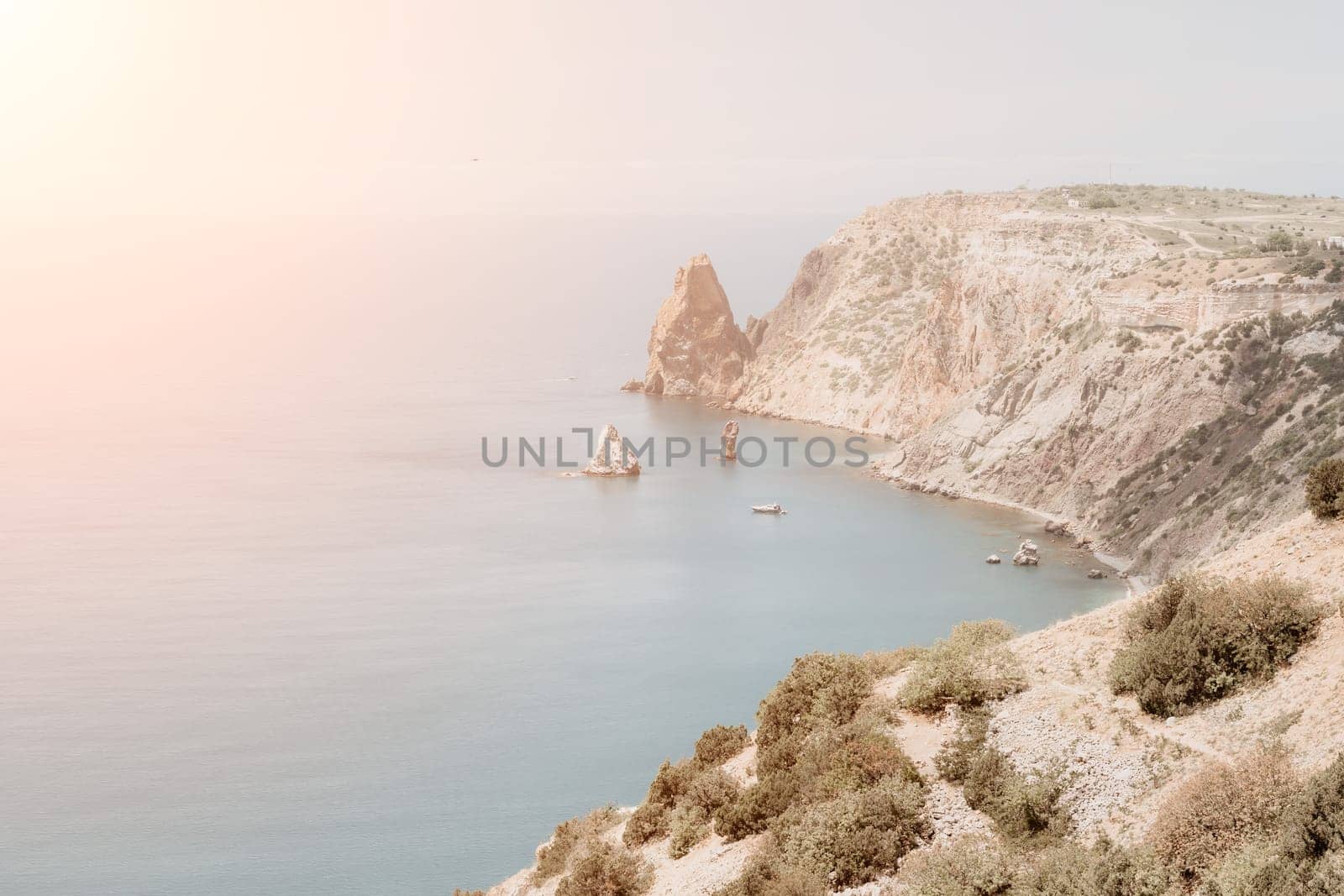 Aerial panoramic view of beautiful sunset above sea. Beautiful seascape. Sun glare, small waves on the water surface. Evening. Horizon. Nobody. No people. Copy space. Never-ending beauty of nature