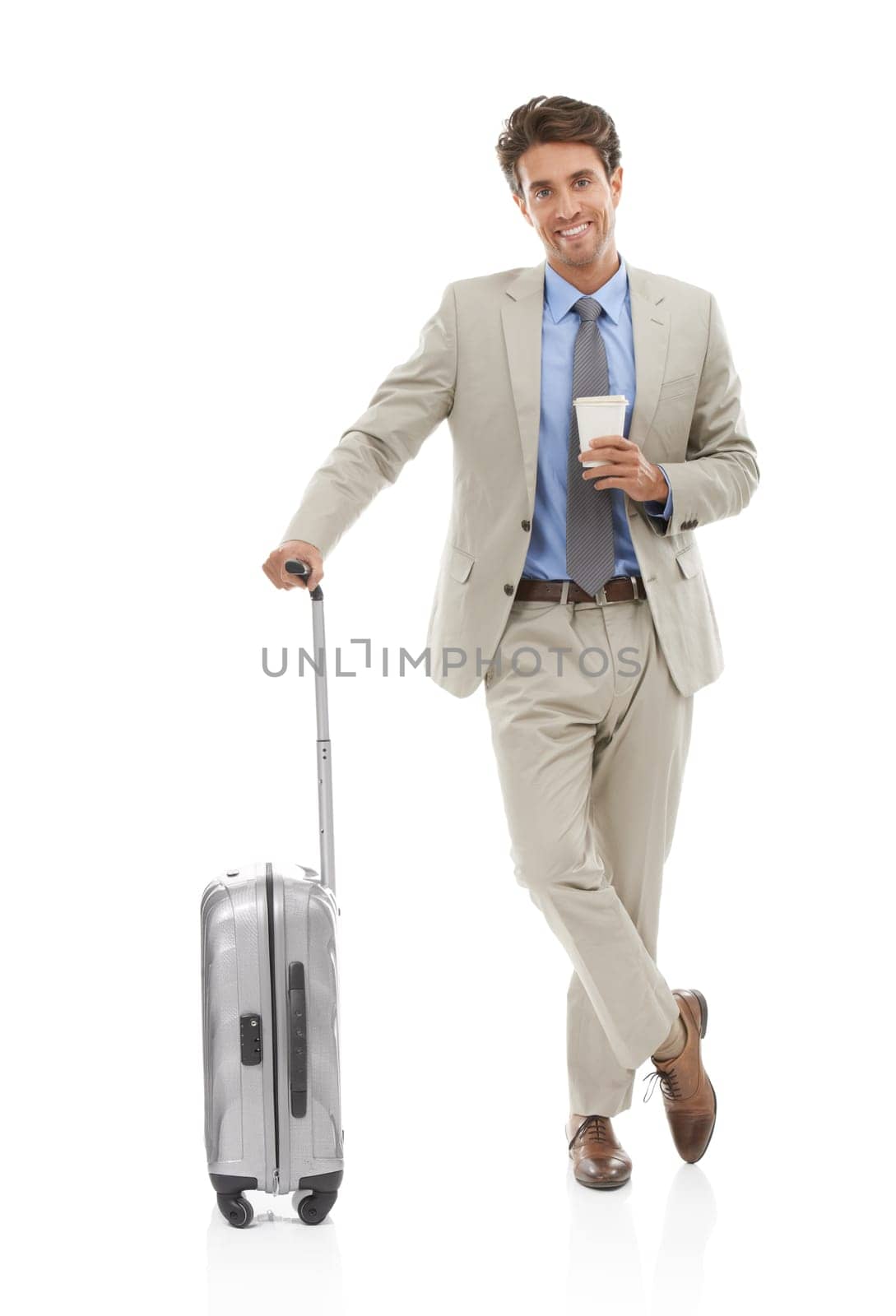Travel is part of my business. Studio portrait of a young businessman with a suitcase and coffee isolated on white