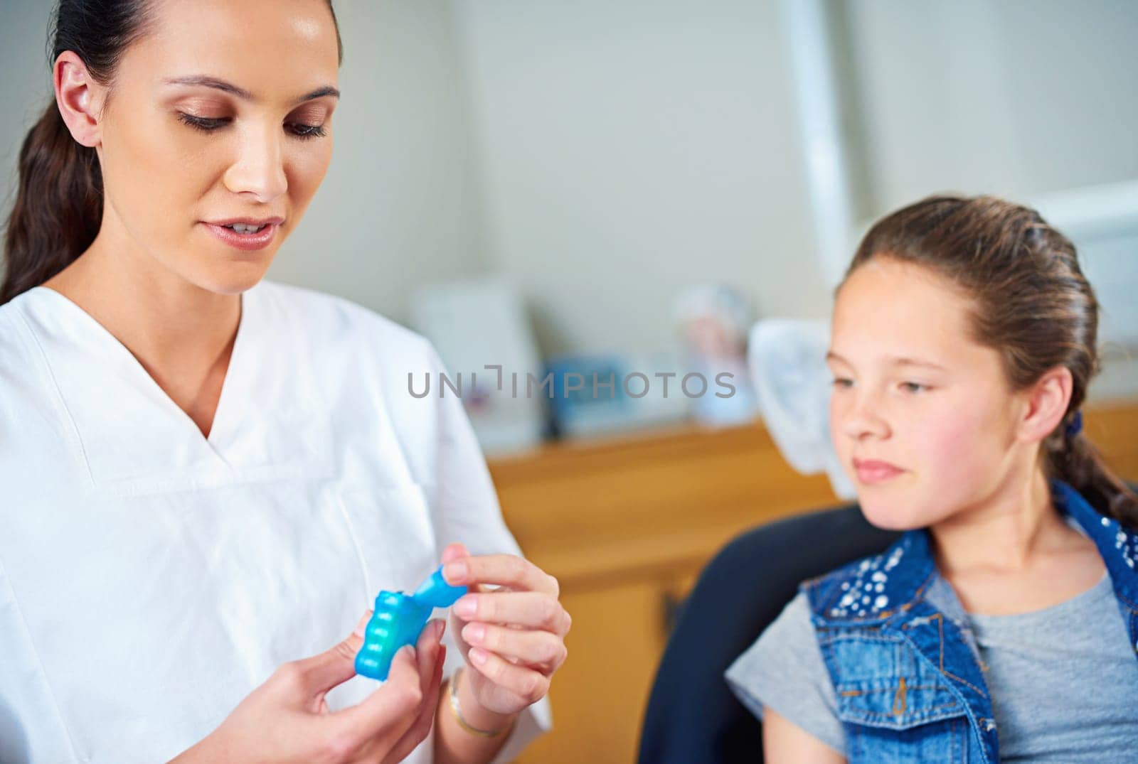 Checkup time. a female dentist and child in a dentist office