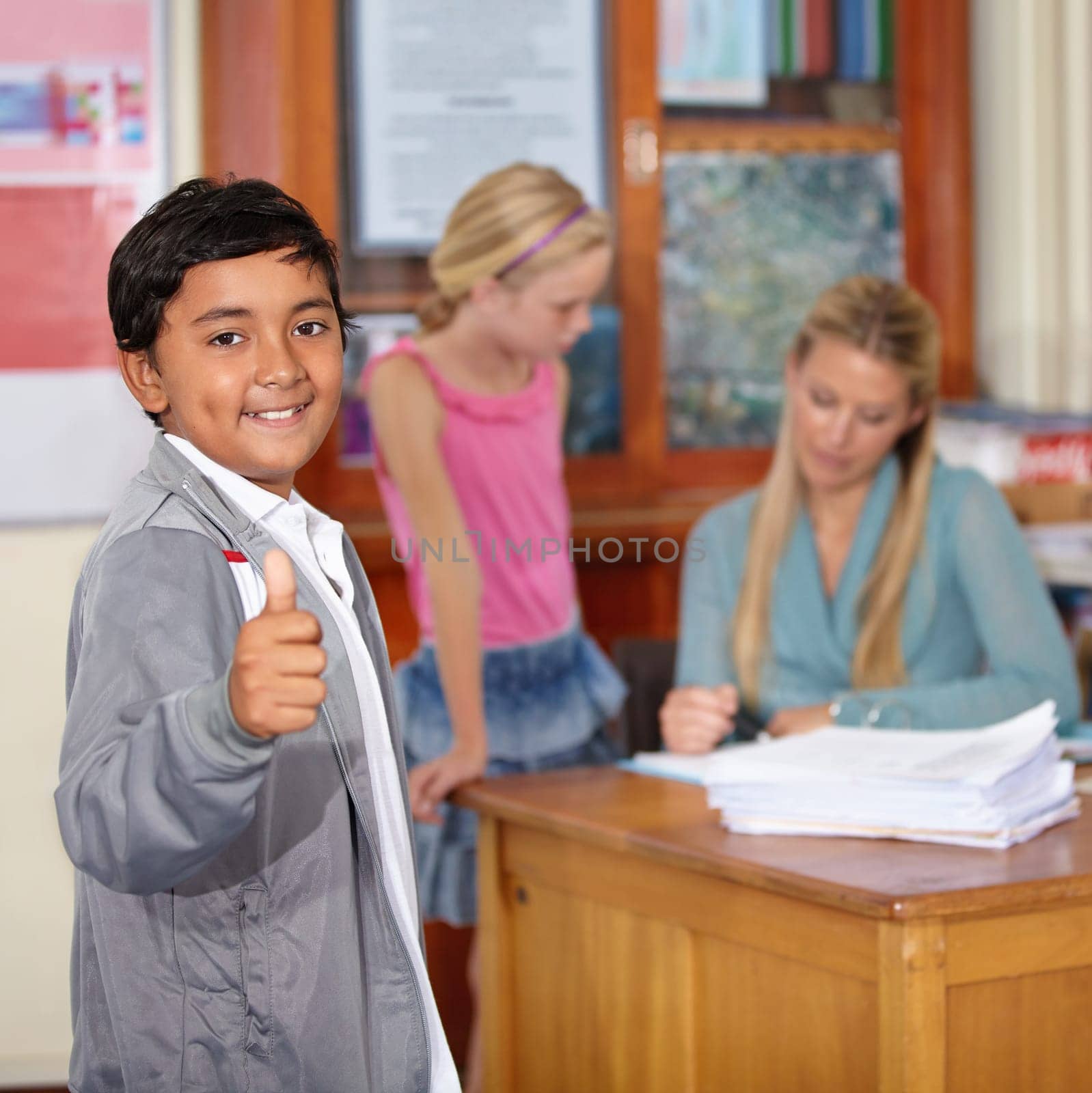 Portrait, child and student with thumbs up, smile and success in classroom. Happiness, hand gesture and kid with like emoji, agreement and approval for learning in elementary school for education