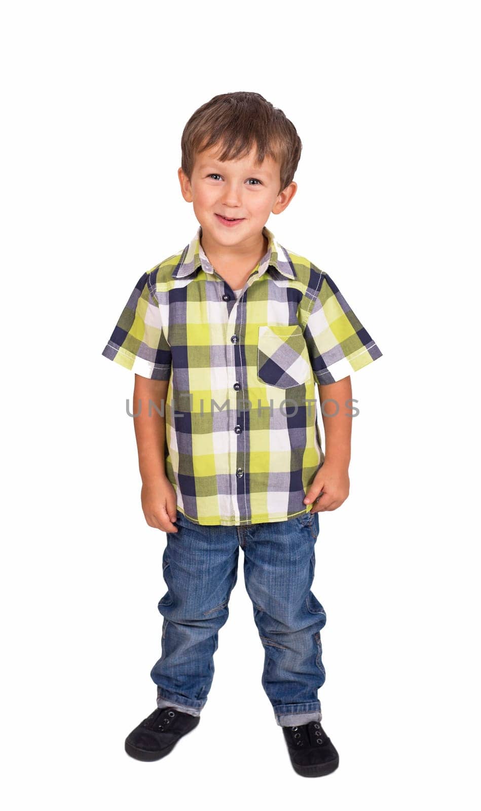 Portrait of a cheerful little boy in jeans and a plaid shirt isolated on a white background