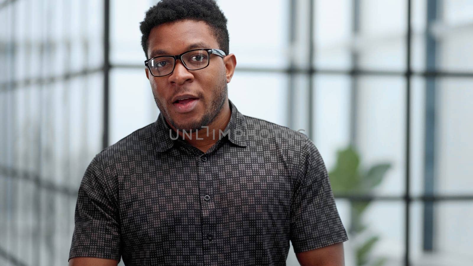 People and lifestyle. Indoor shot of a young confident black businessman looking serious