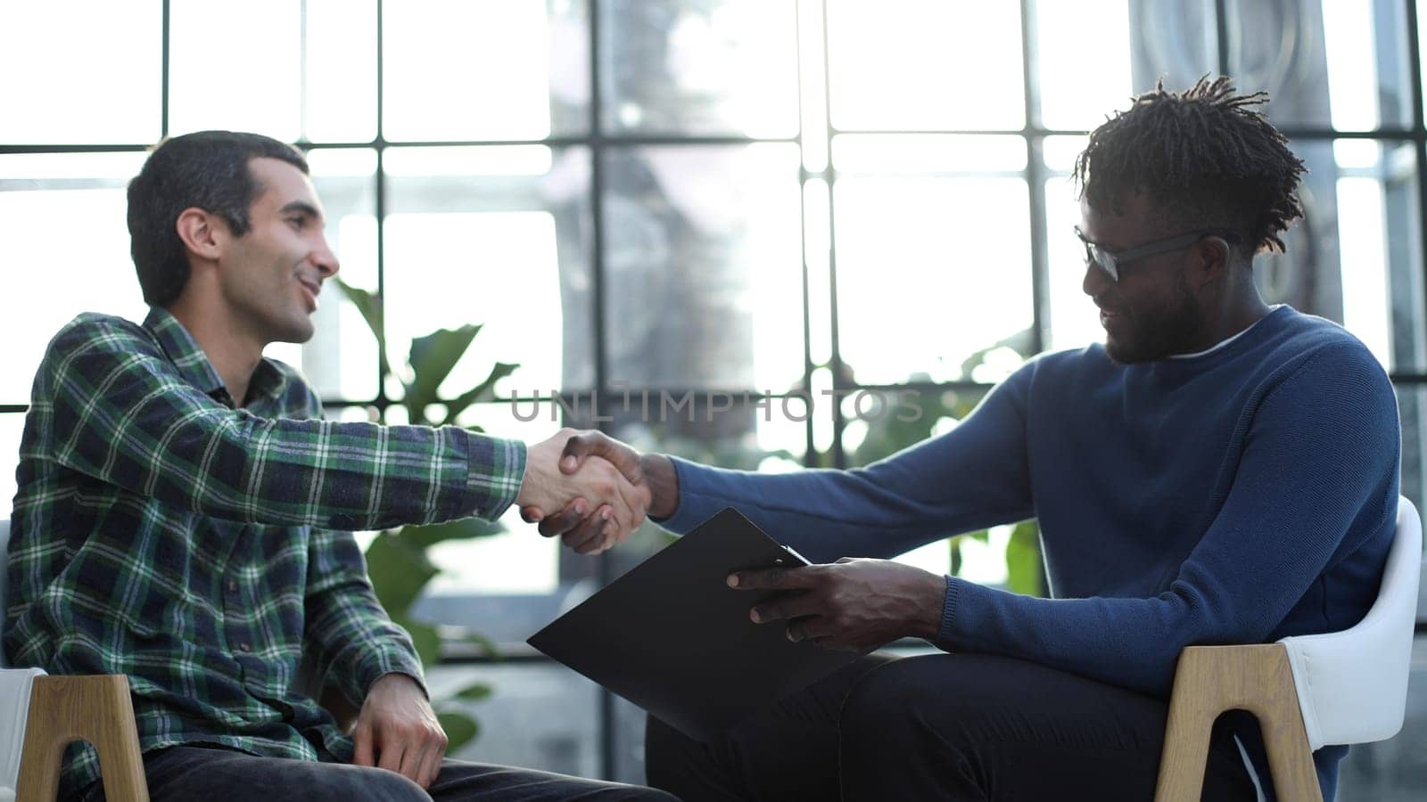 Business partners having a meeting, shaking hands
