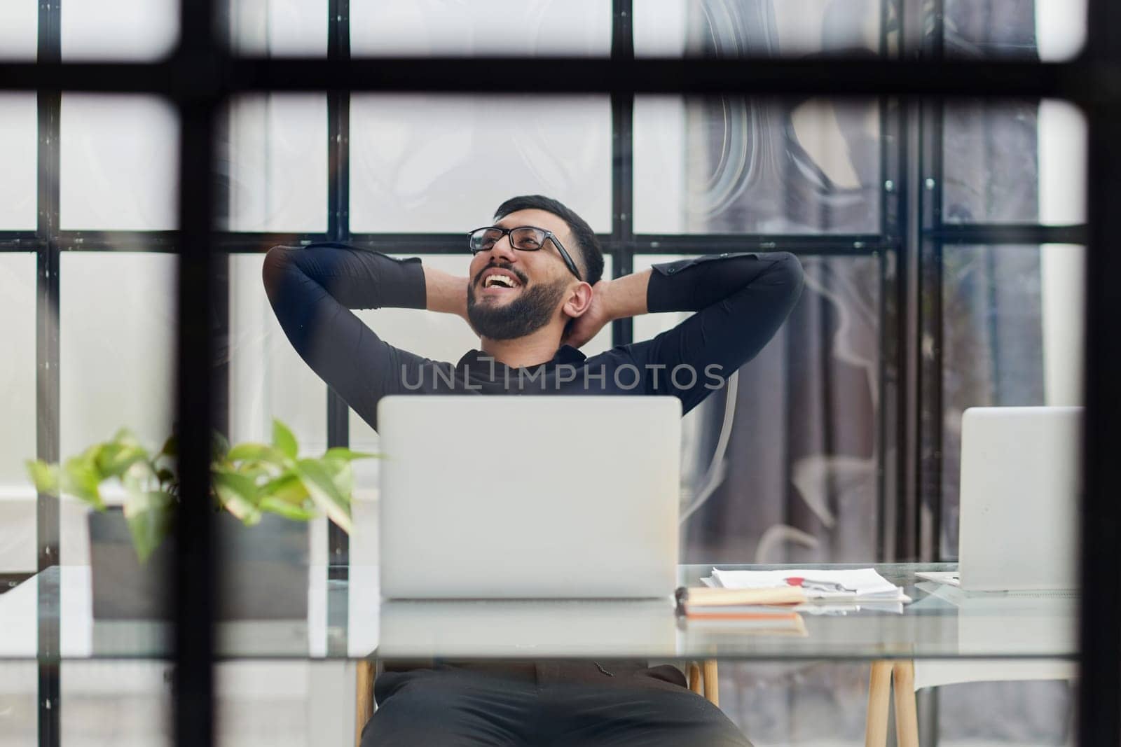 Middle-aged man working on laptop in office