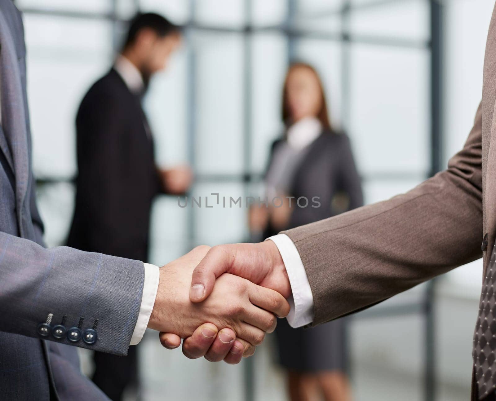 Nice to meet you. Close-up of two young businessmen shaking hands