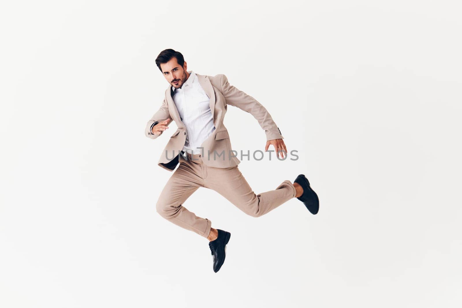 man suit arm stylish standing businessman smiling winner happy running sexy business flying confident victory occupation jacket person fashion tie beige male