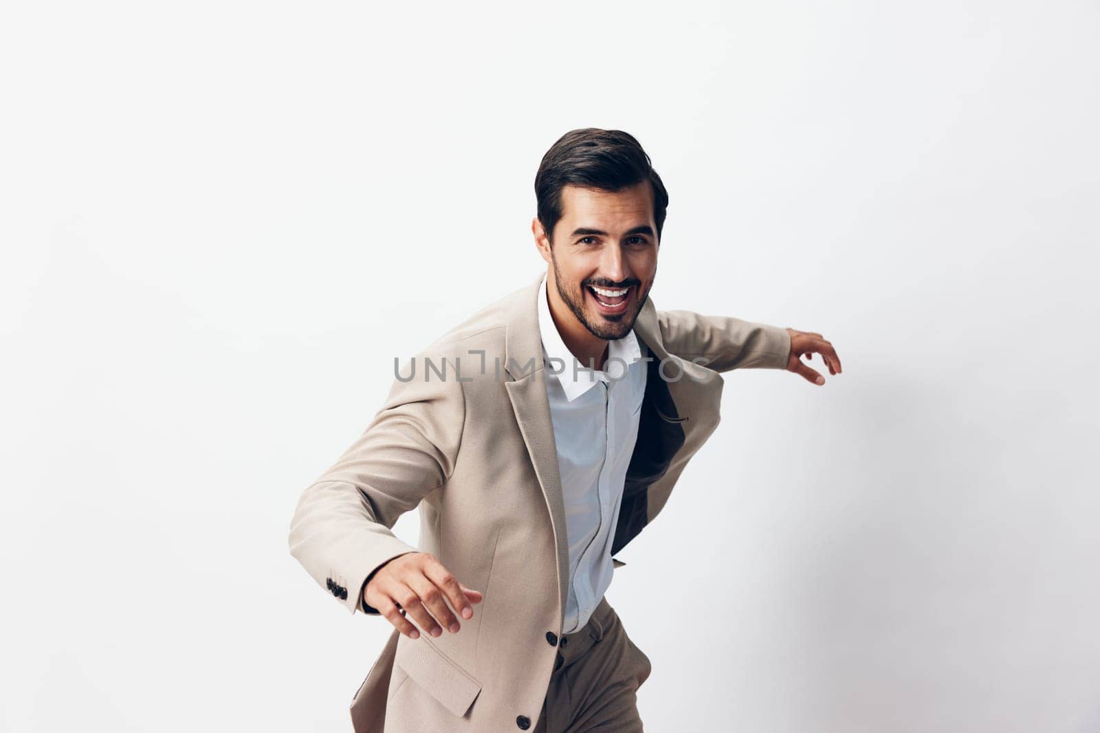 suit man businessman white idea winner professional beige running model smiling tie portrait victory young up business flying hand office happy