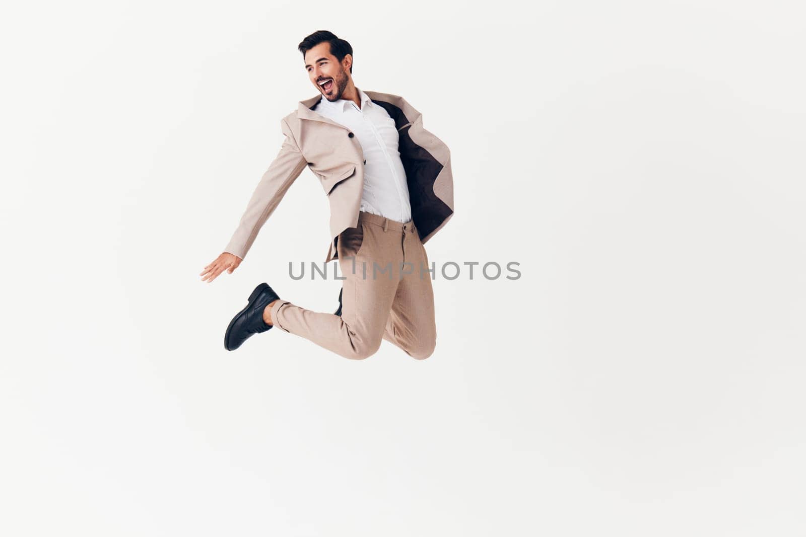 man office flying adult occupation happy running flying beige studio male up winner businessman person jacket job portrait business victory suit smiling