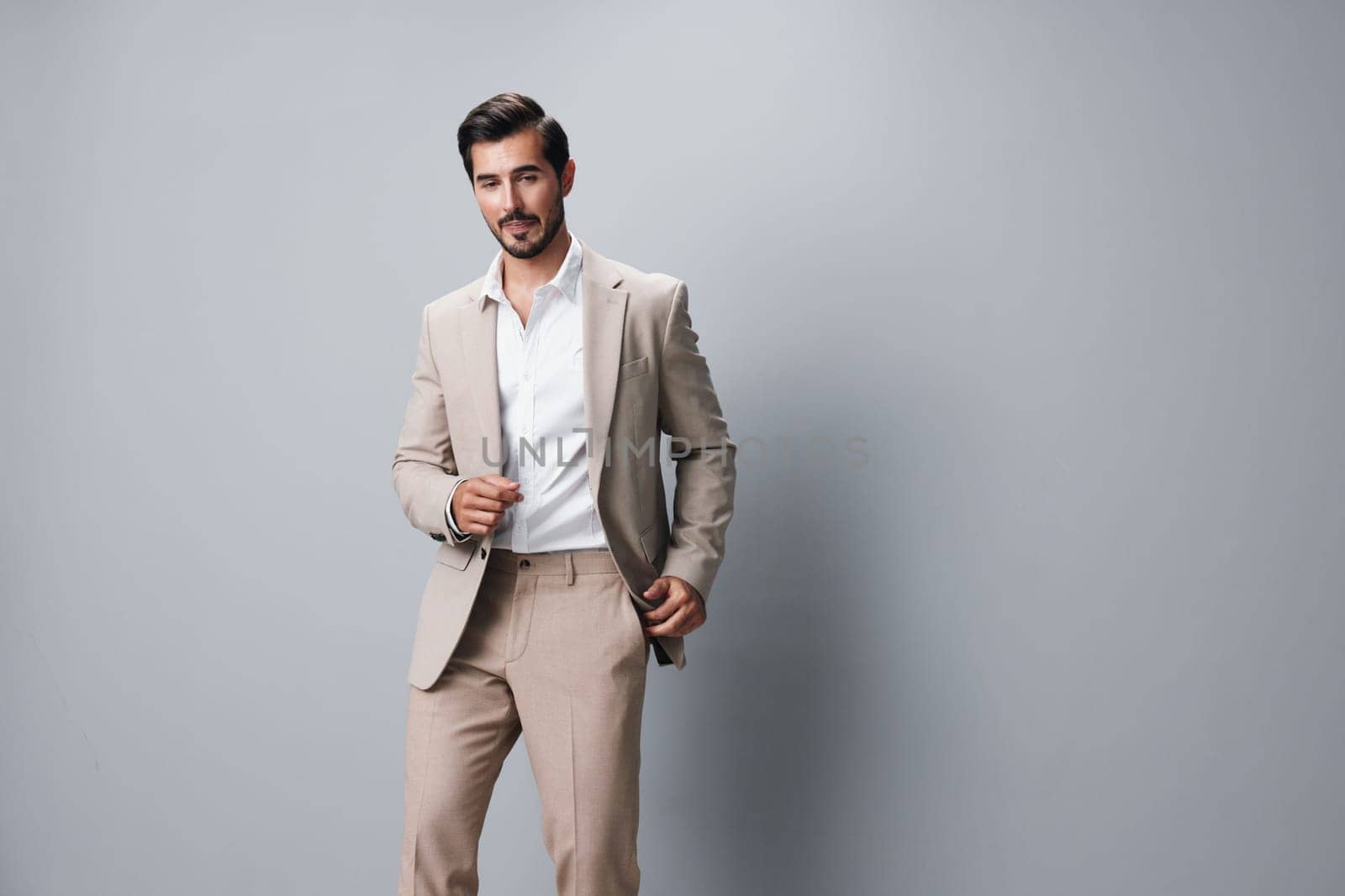 man businessman copyspace standing portrait success beige happy posing handsome beard successful attractive background isolated suit executive occupation business smiling folded