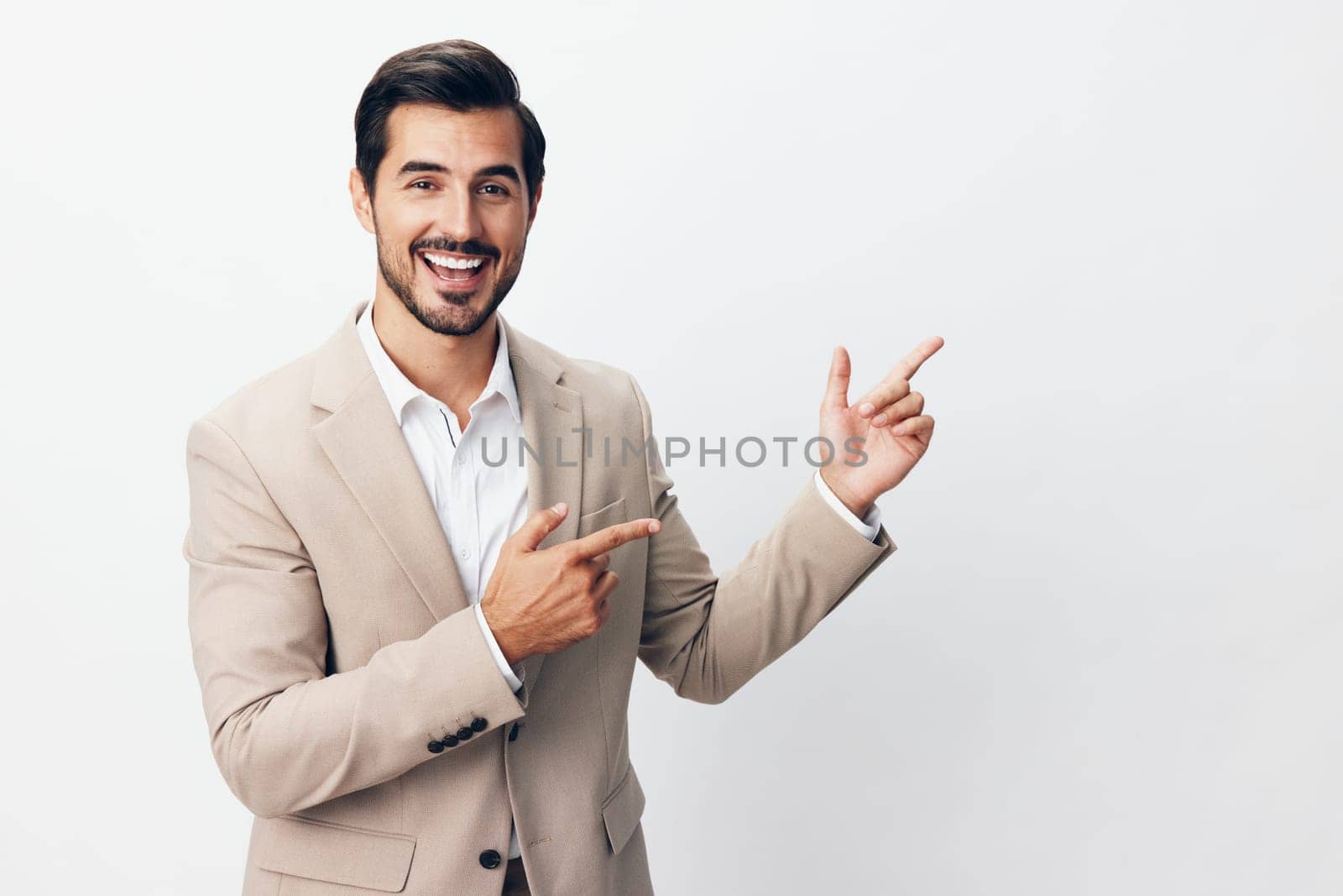 standing man victory tie hand businessman business shirt arm up beige idea winner happy suit background professional fashion person smiling isolated