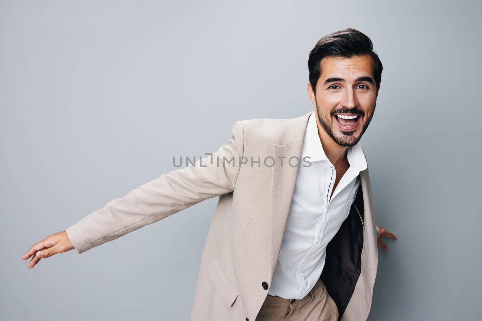 man smiling victory suit hand happy beige winner business businessman arm by SHOTPRIME