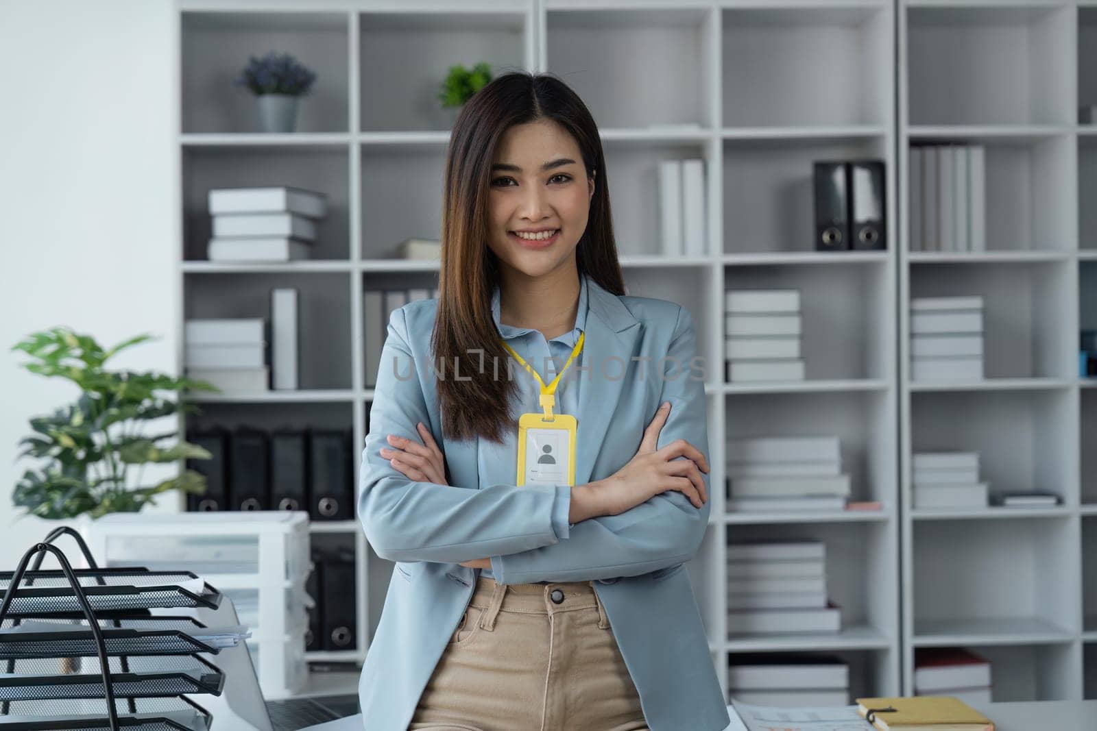 Happy business lady smiling to camera posing working sitting at workplace in office.