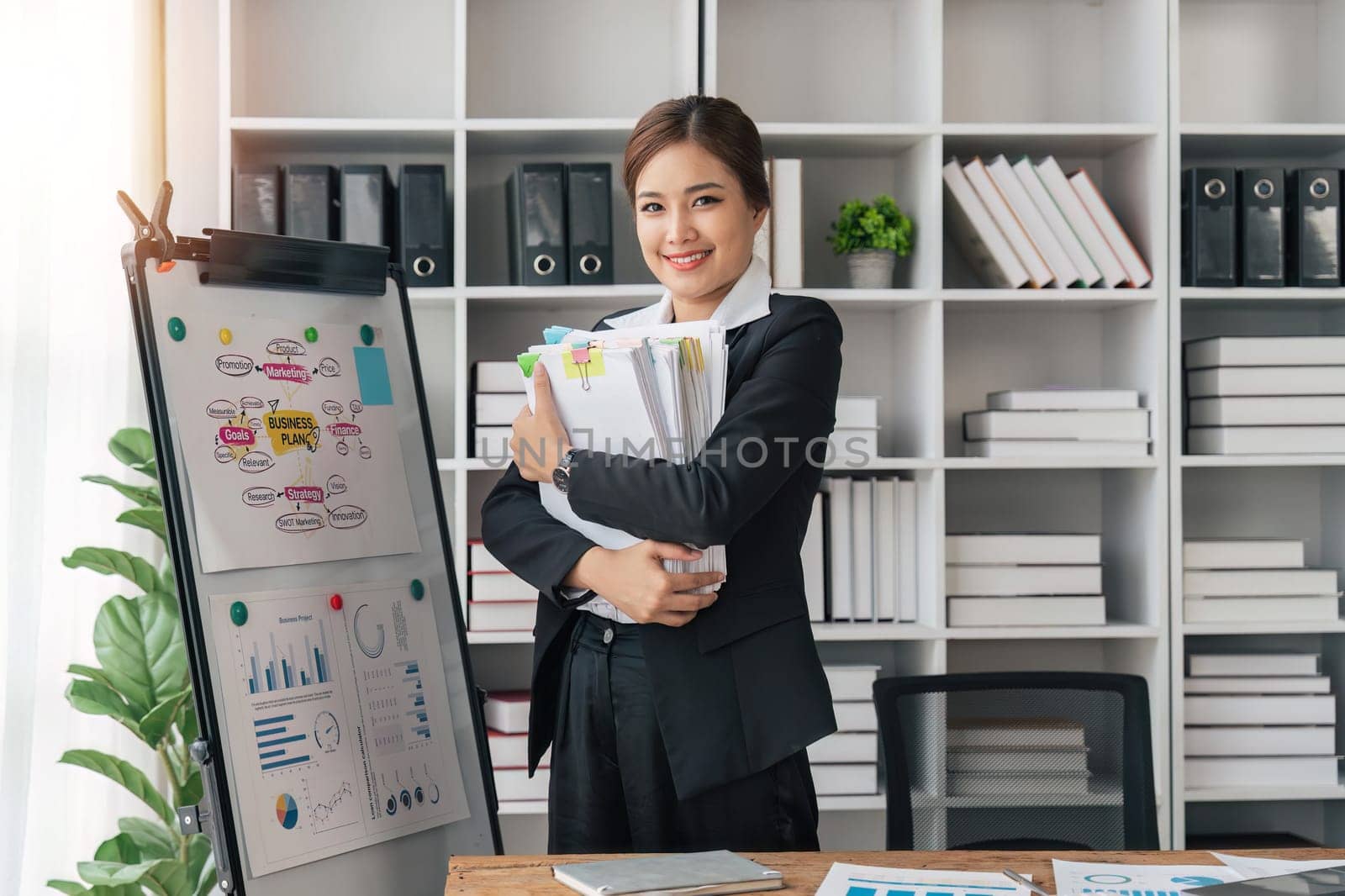 woman hands working in stacks of paper files document achieves on folders papers. copy space.