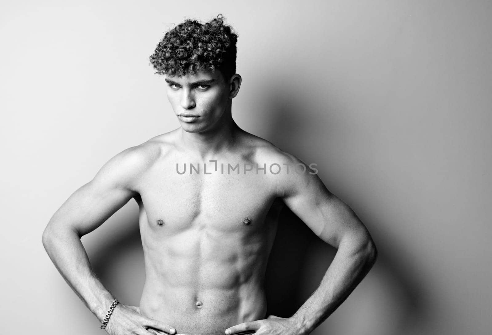 man bodybuilder shirtless caucasian sport athlete stylish beauty young white bodybuilding black and white by SHOTPRIME