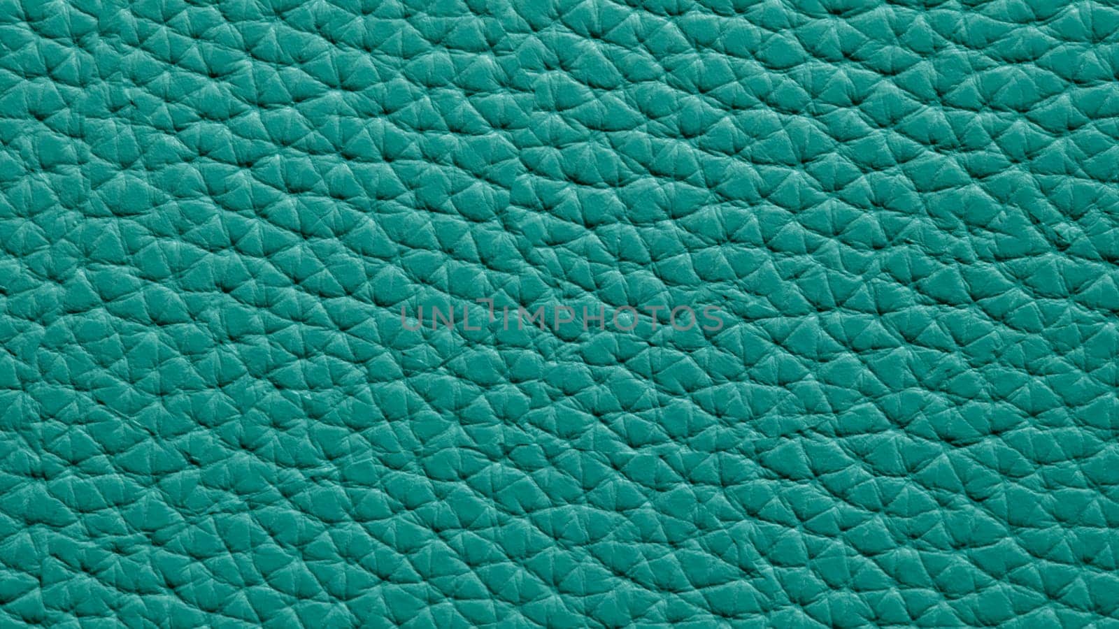 Green corrugated genuine leather background closeup macro by kuprevich