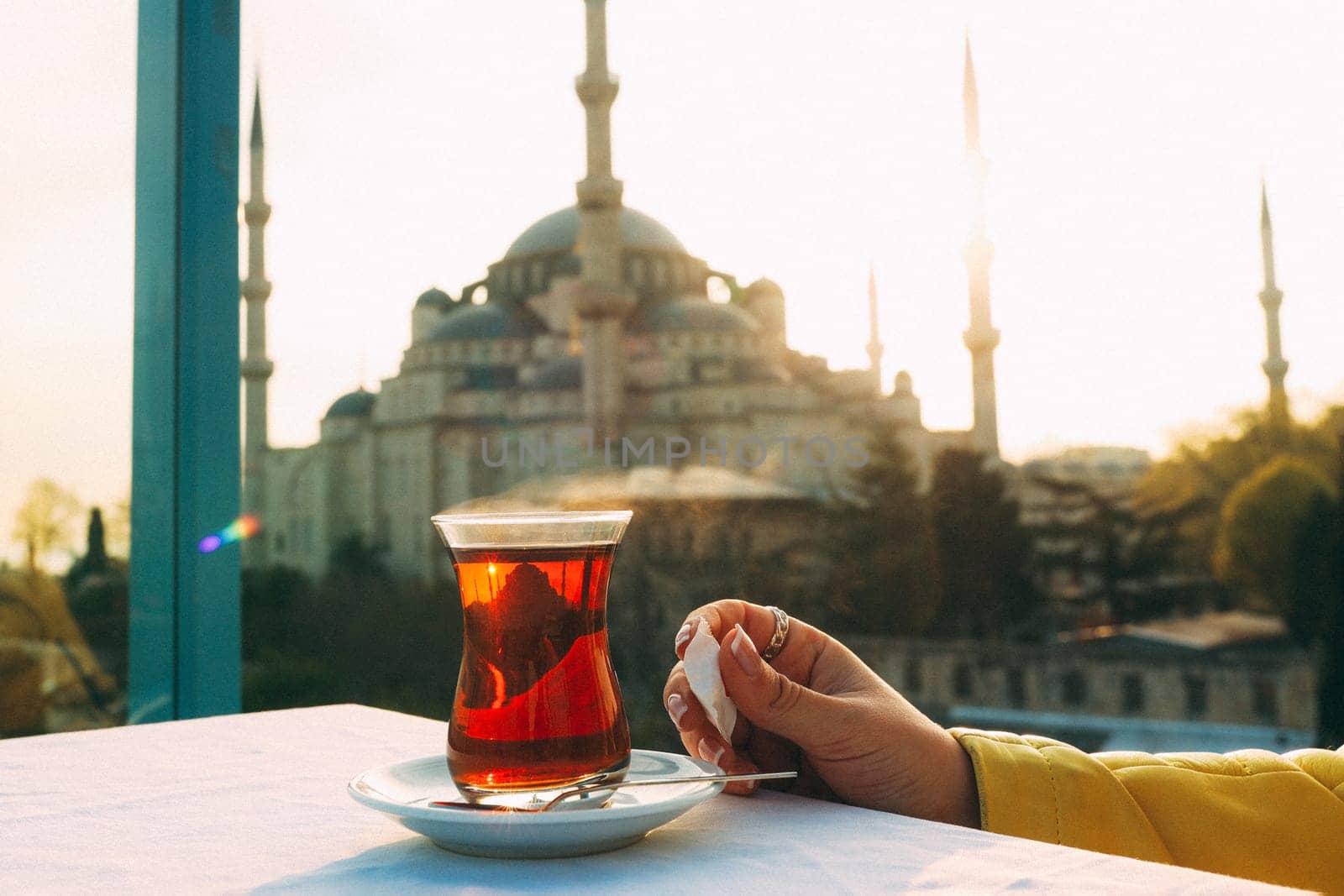 A glass of Turkish tea on the background of Hagia Sophia in Istanbul. High quality photo
