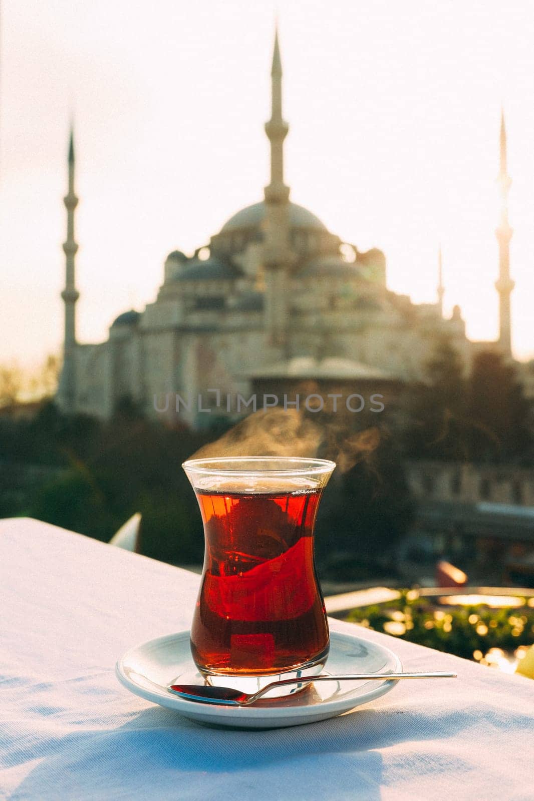 A glass of Turkish tea on the background of Hagia Sophia in Istanbul. High quality photo