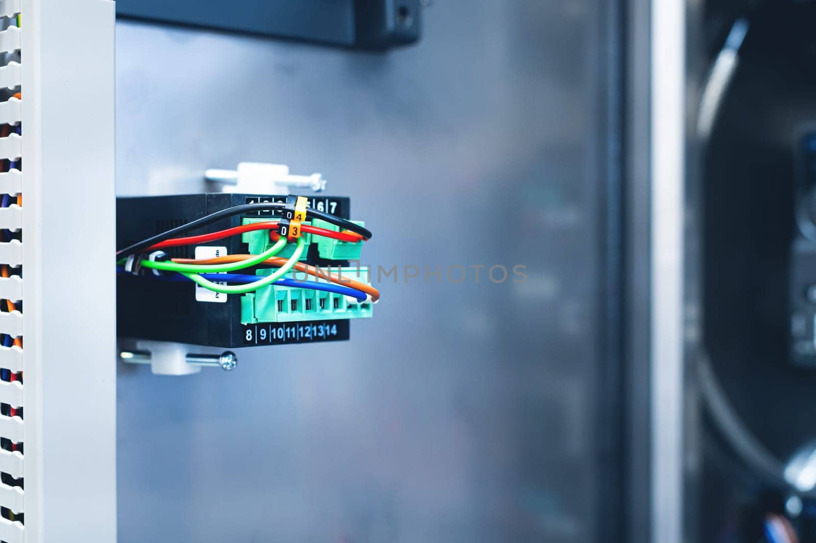 Electrical equipment. Cabinet with electrical appliances close-up. Numbered power equipment with wires. Marked elements in the shield. Electrical equipment