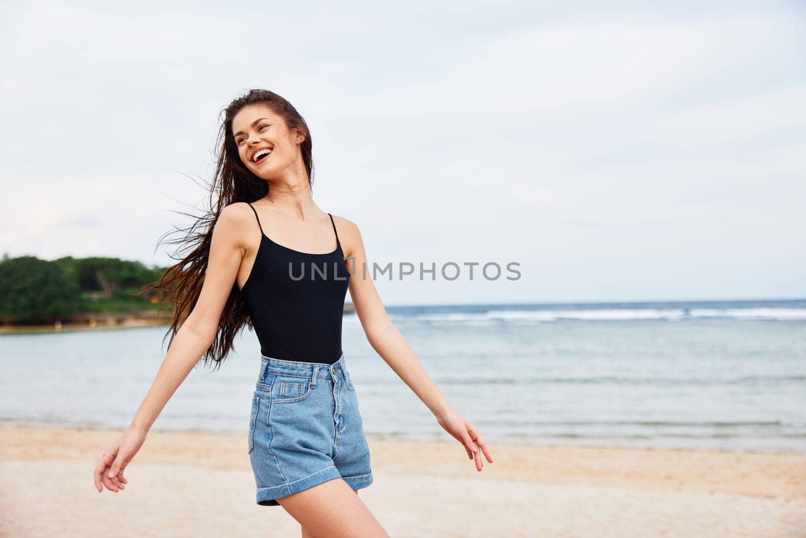 beach woman sea summer female young running lifestyle sunset smile travel by SHOTPRIME