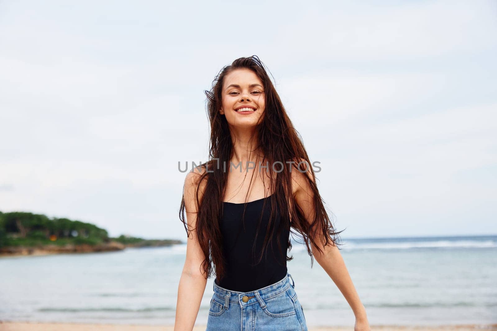 beautiful woman space young ocean water fun lifestyle nature sunset sea smile travel body positive beach sand wave summer copy running leisure