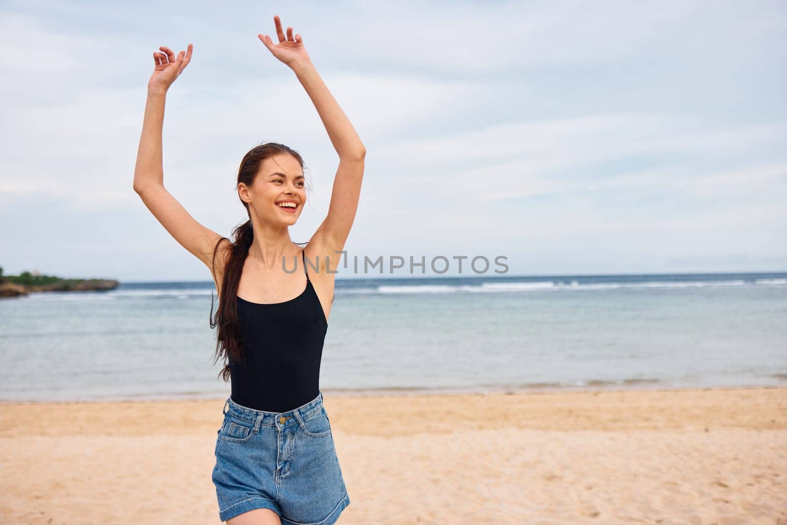 running woman summer travel lifestyle vacation sunset shore young beautiful smile water freedom copy sea space beach flight walking ocean bikini positive