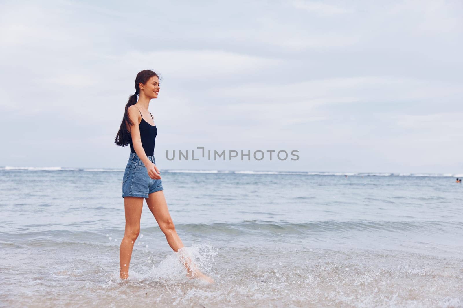 woman running lifestyle sea sunset space beach summer young travel copy smile by SHOTPRIME