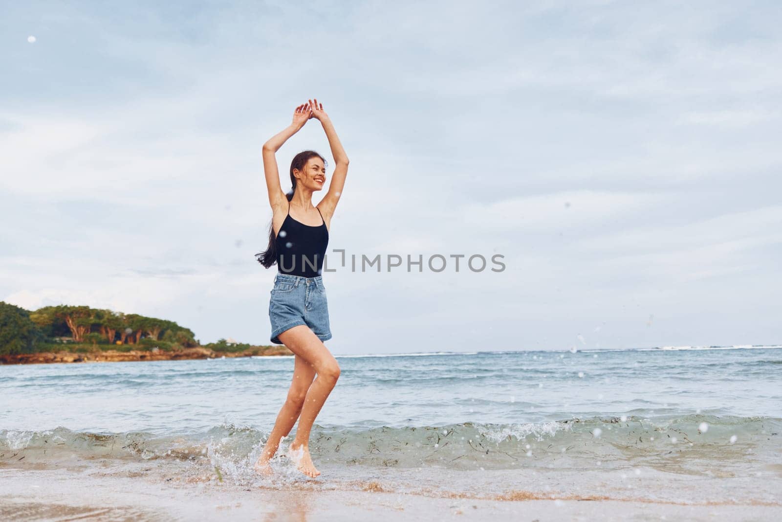 running woman long nature tan person sea summer sun smile girl lifestyle beach water wave travel hair beautiful ocean active young sunset