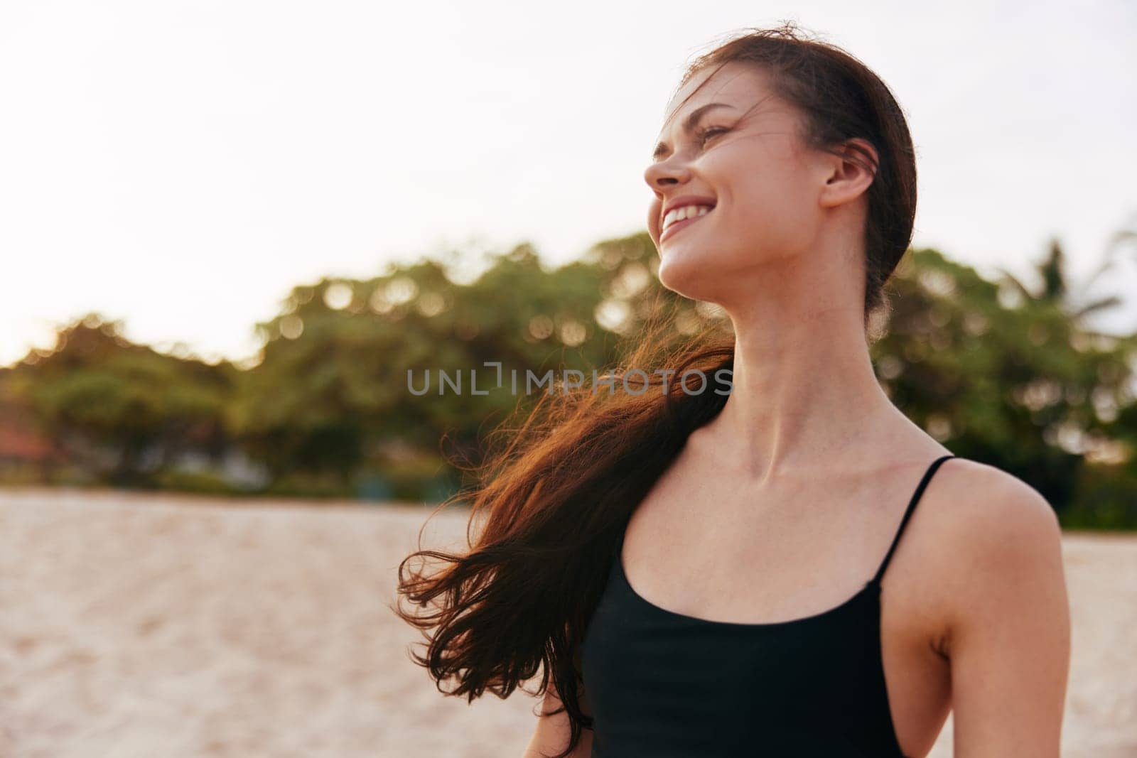 woman beach sunset lifestyle summer sand ocean vacation smile sea jean by SHOTPRIME