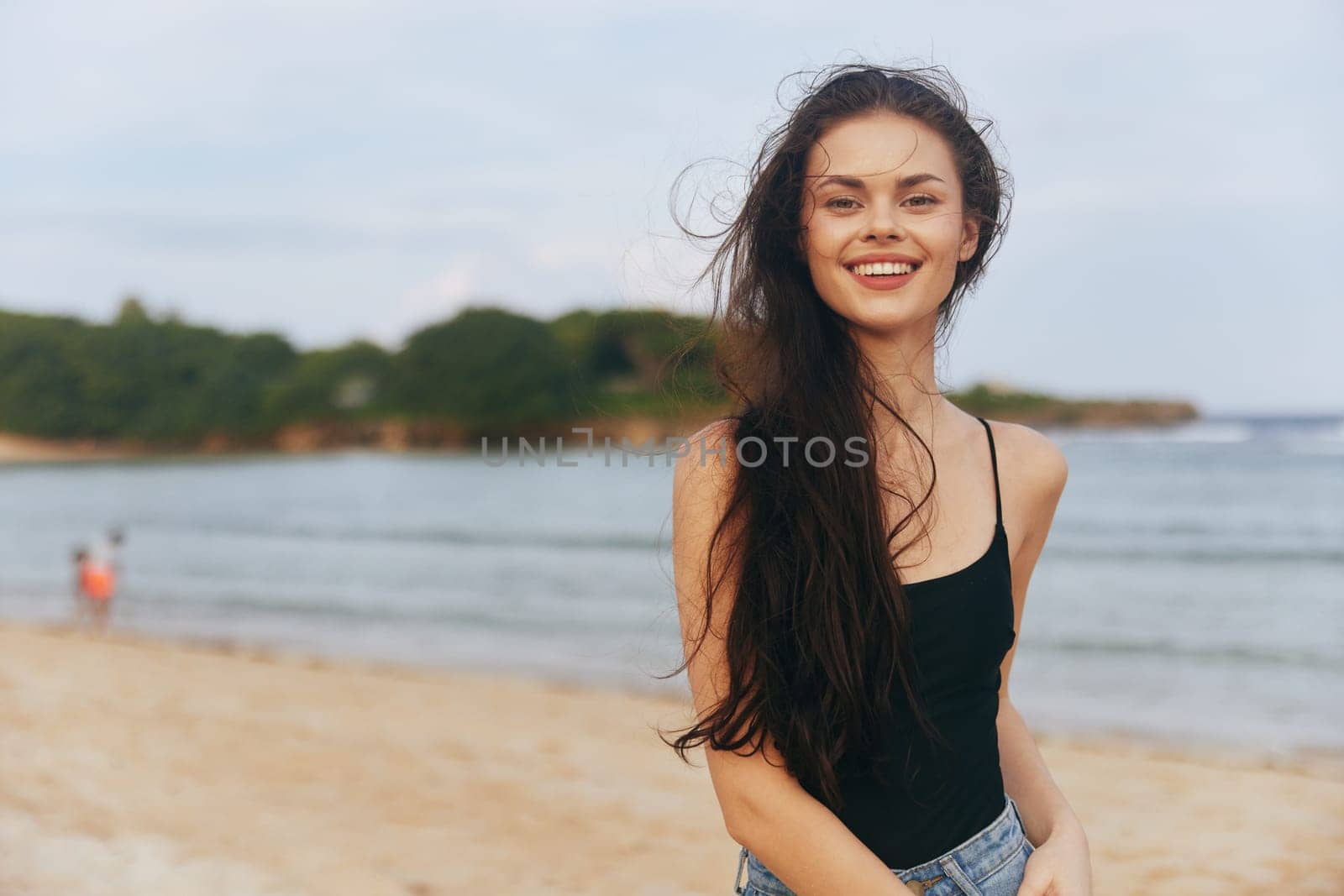 jean woman lifestyle summer sunlight smile dress enjoyment smiling relax adult girl sea ocean sunset sand beach running happy person vacation