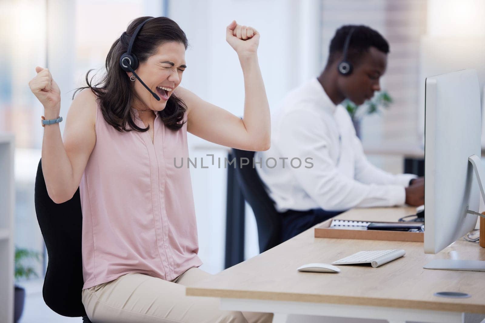Success, winner or excited consultant in call center happy with telemarketing sales target or goals. Fists, CRM communication or woman celebrates winning an achievement or bonus deal at IT support.