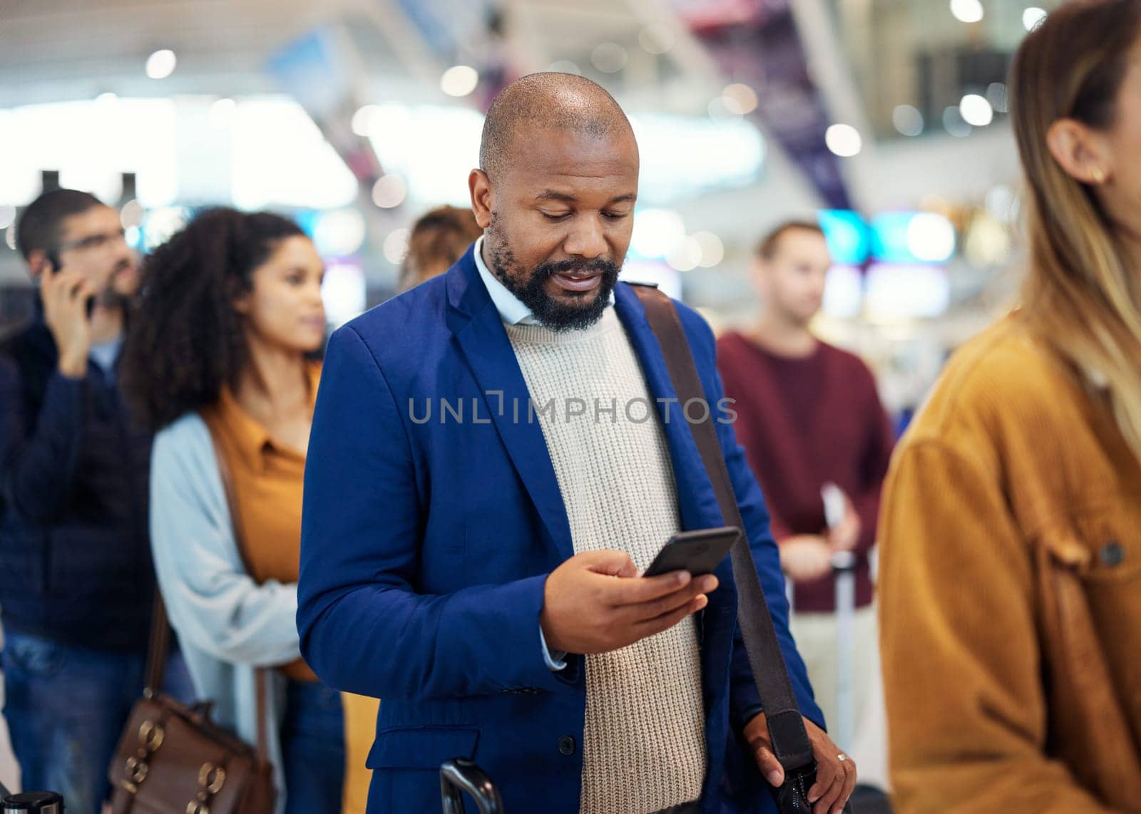 Travel, search and phone with black man in airport for flight, vacation and immigration. Queue, communication and technology with businessman in line with luggage for trip, holiday and first class by YuriArcurs
