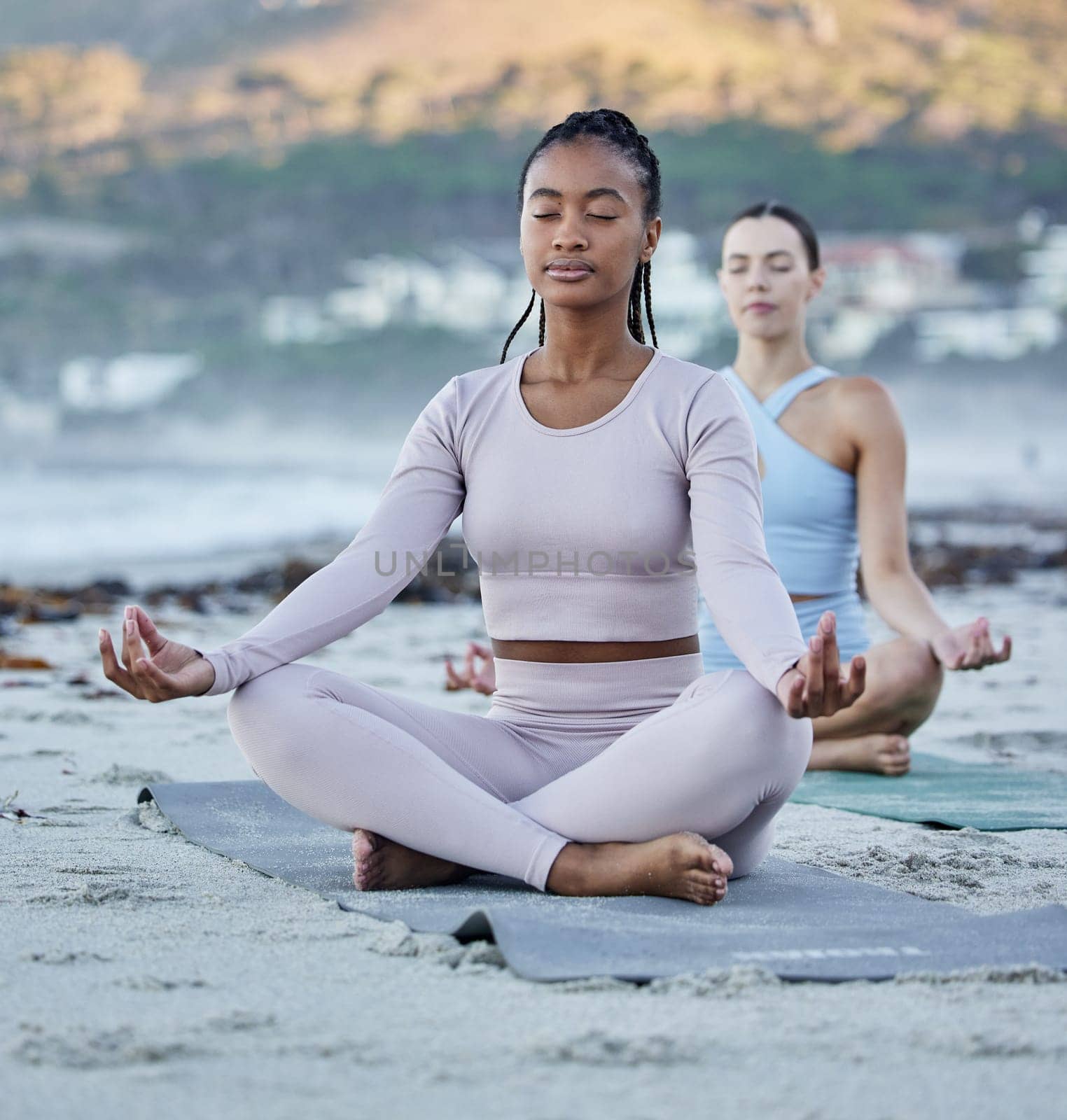 Beach meditation, diversity and yoga women meditate for chakra energy healing of soul, aura or spiritual balance. Freedom, lotus and zen people relax on sand for mindset peace, pilates or mindfulness.