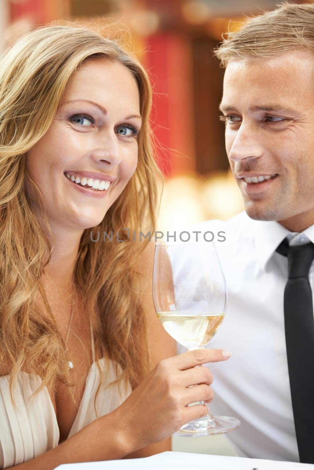 Love, couple and champagne for celebration, happiness and achievement outdoor, romance and joyful. Portrait, man and woman with alcohol, wine glass and Valentines day date, relationship and smile by YuriArcurs