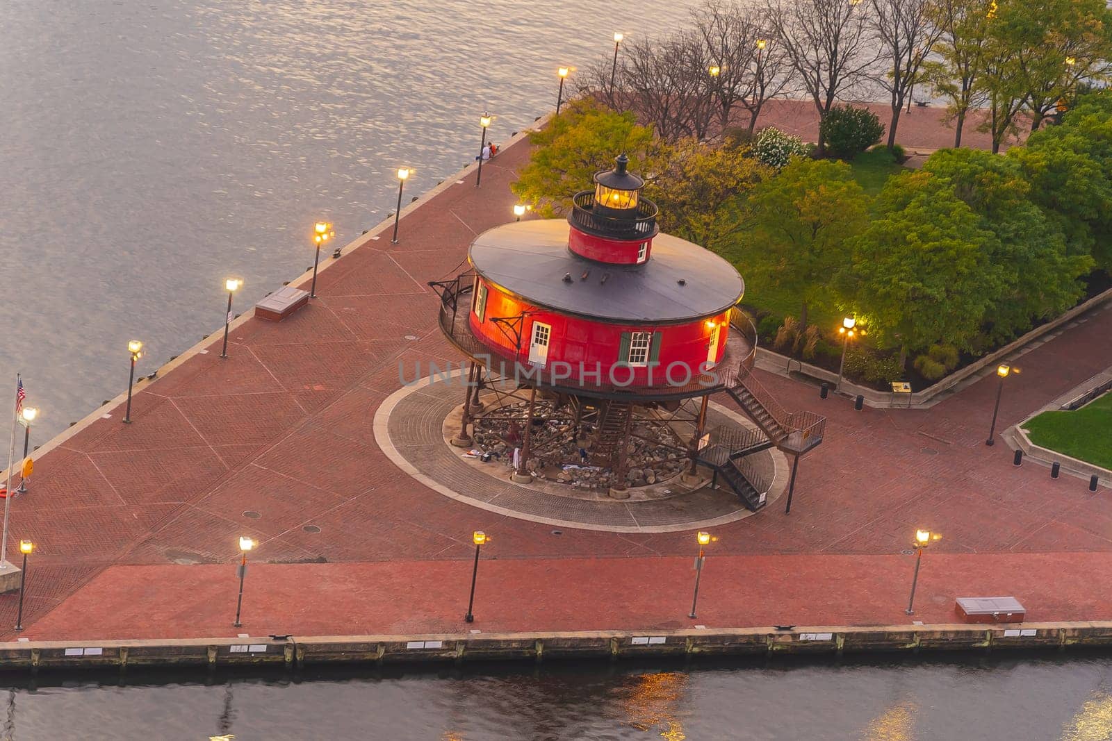 Red lighthouse at night, the Inner Harbor in Baltimore, Maryland by f11photo