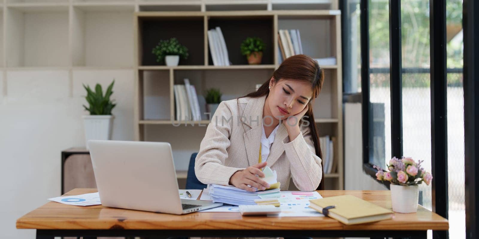 Deadline with young business woman feeling stressed concept. Business woman working at office, business finance concept.