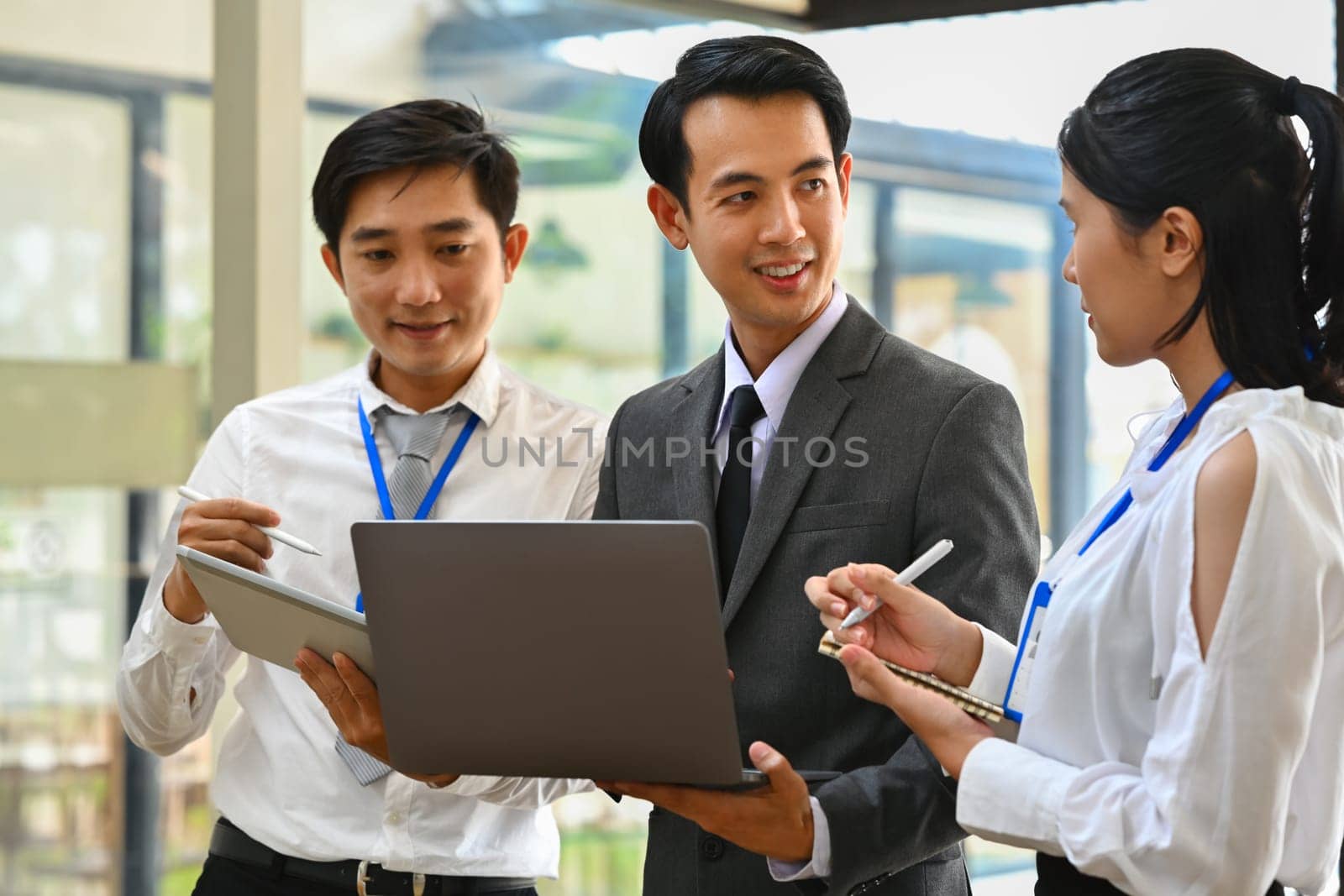 Image of business team discussing startup project, sharing business ideas during corporate briefing.