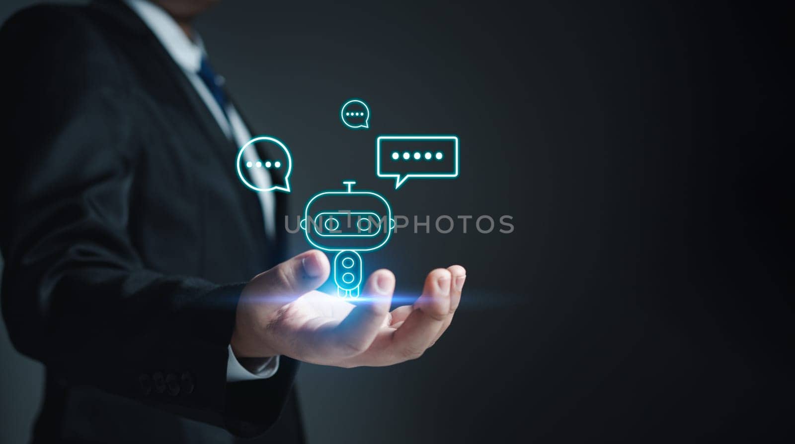 Chatbot. Ai. Robot. Businessman in suit holding a virtual model of artificial Intelligence. Using artificial Intelligence helps to work more efficiently.