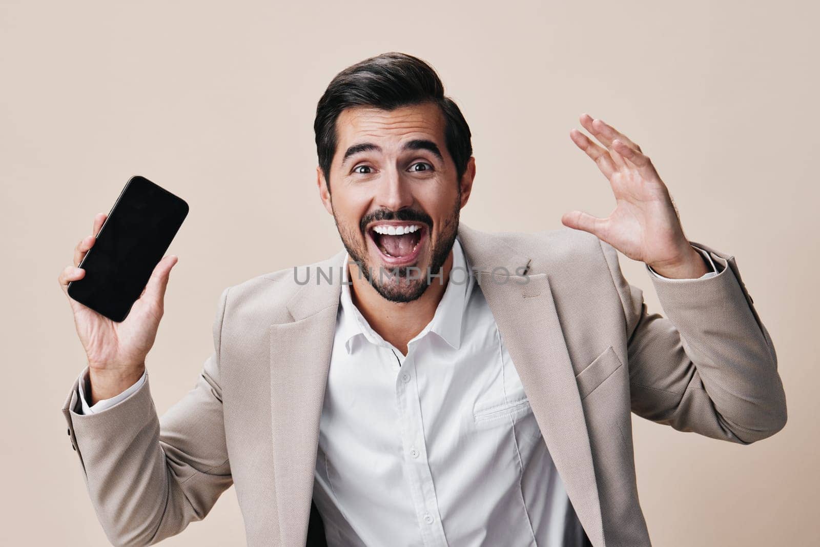 man suit business copy hold portrait smartphone phone smile space call happy by SHOTPRIME