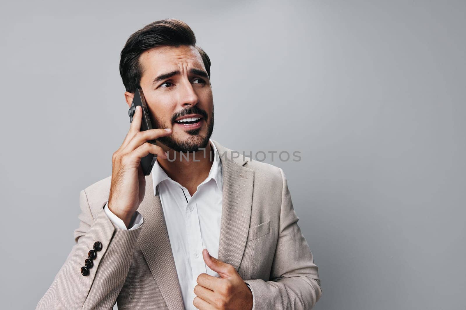 man business smartphone call angry phone application smile suit hold portrait by SHOTPRIME