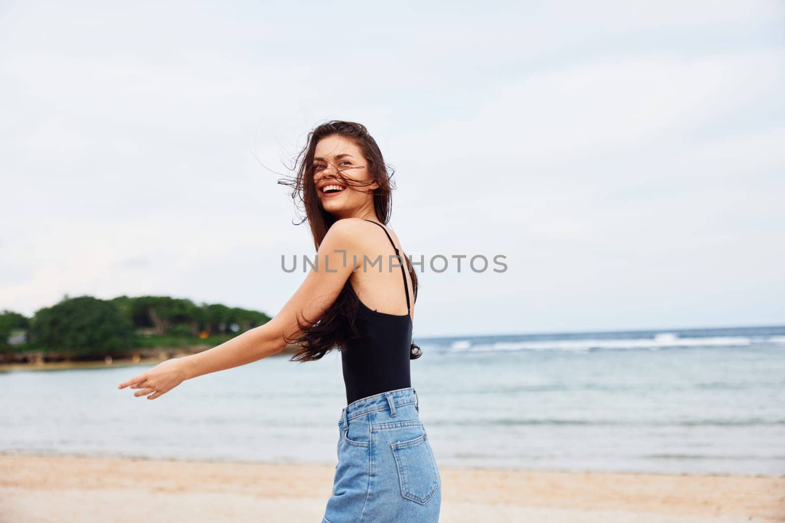 woman young running happiness lifestyle sunset sea summer travel beach smile by SHOTPRIME