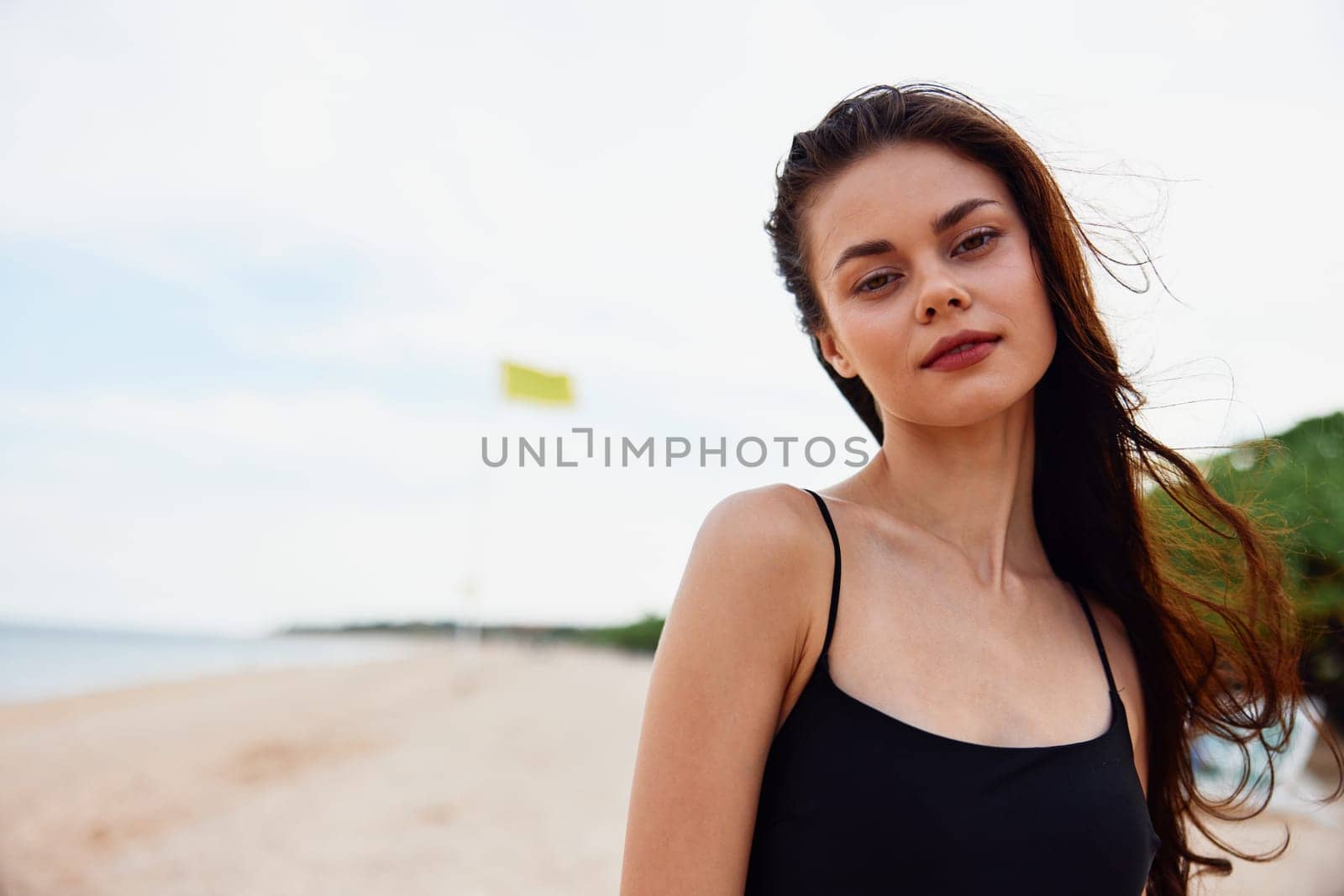 woman beach copy sand sea enjoyment peaceful nature walk beautiful summer adult holiday smile sun young ocean walking space caucasian sunlight vacation