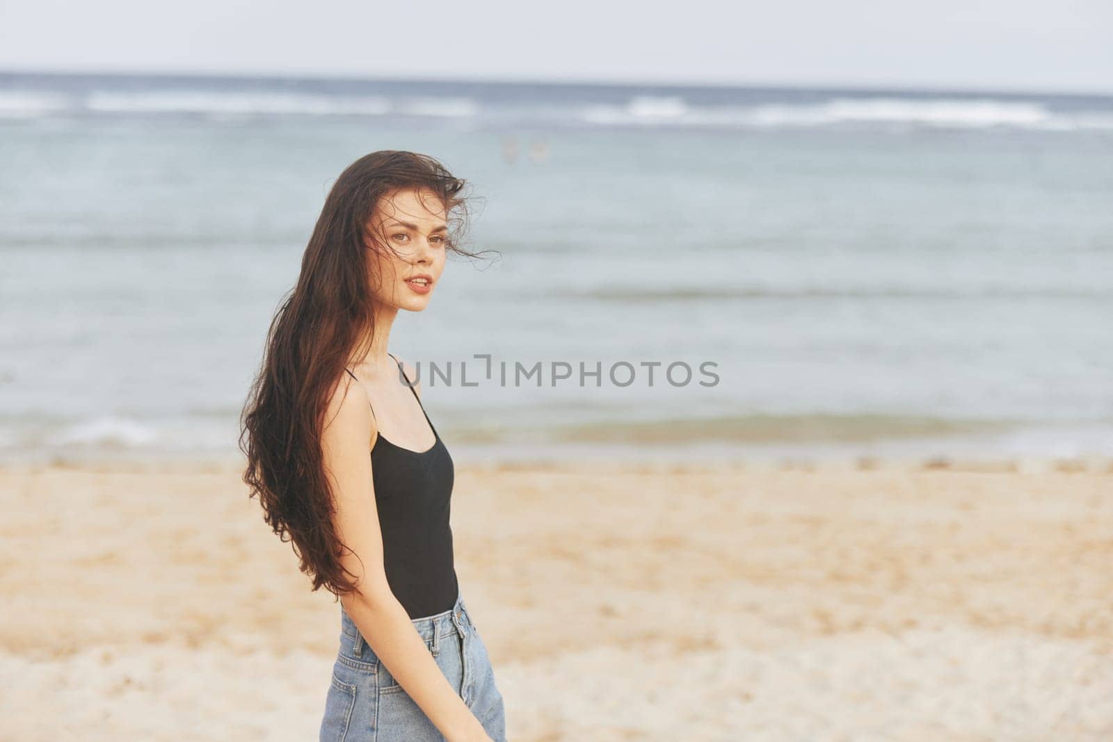 woman beautiful smile person lifestyle summer sea holiday sunset walking sand caucasian vacation peaceful ocean travel beach freedom sky girl sunlight
