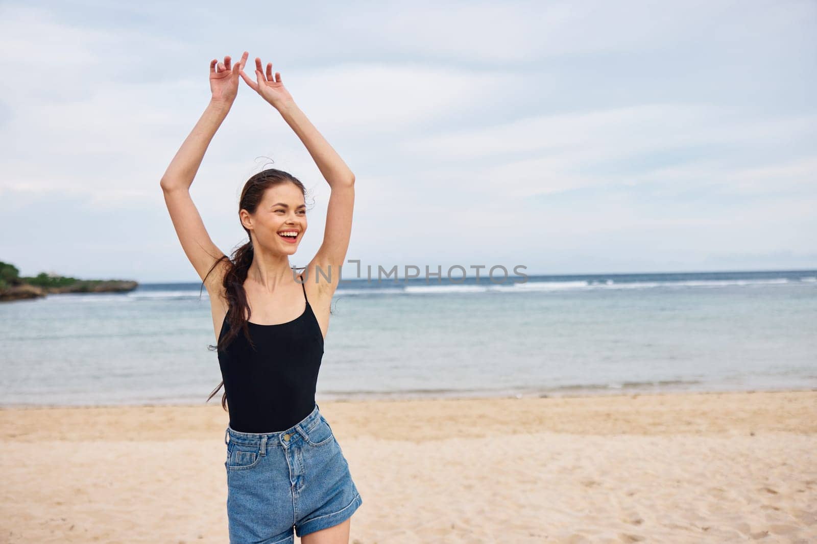 woman travel hair carefree relax beach walking smile wave girl happy running summer flight lifestyle long sunset person shore young vacation sea