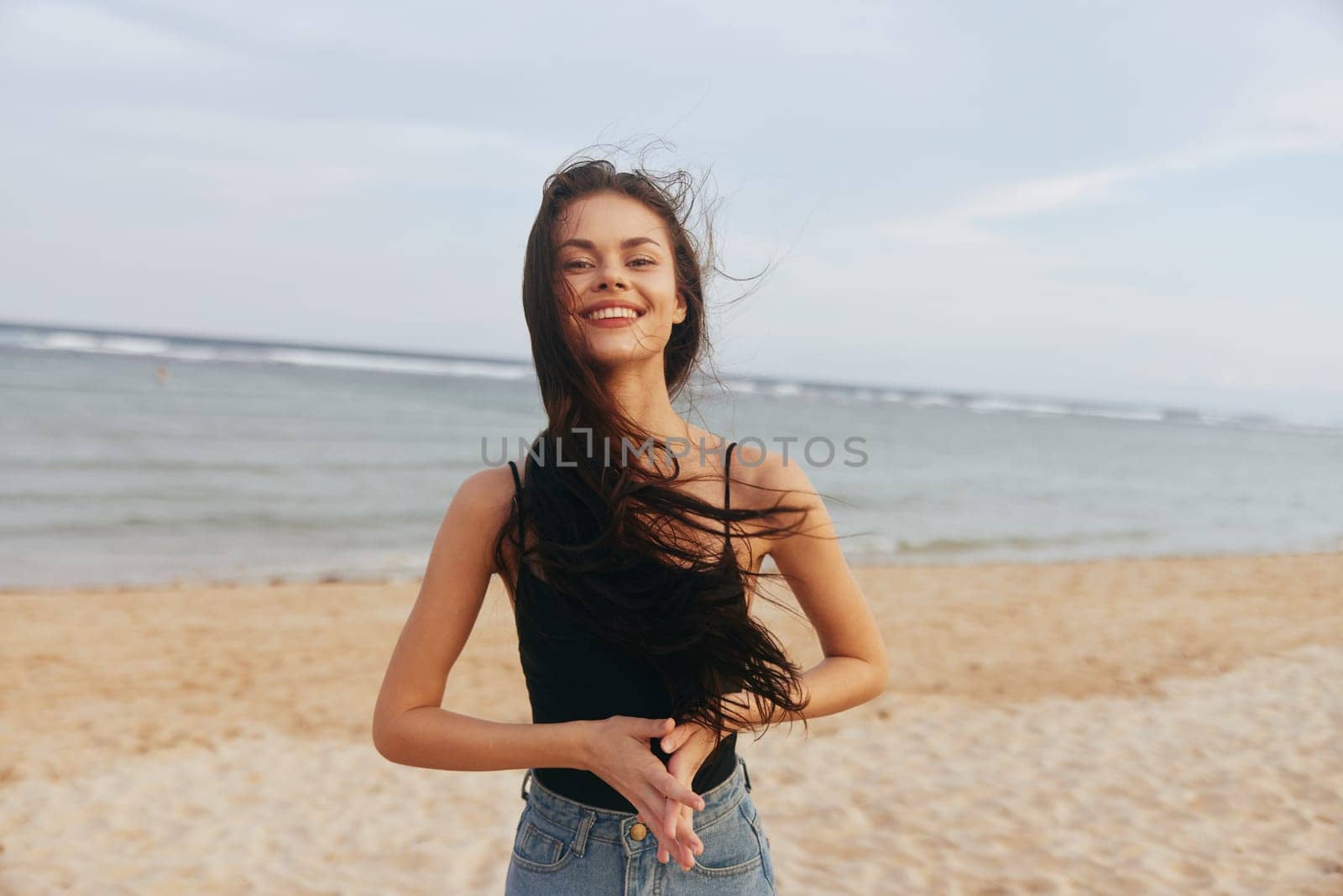 ocean woman copy-space travel enjoyment beach female running freedom smile space summer tropical lifestyle relax sand sea coast vacation copy sunset peaceful