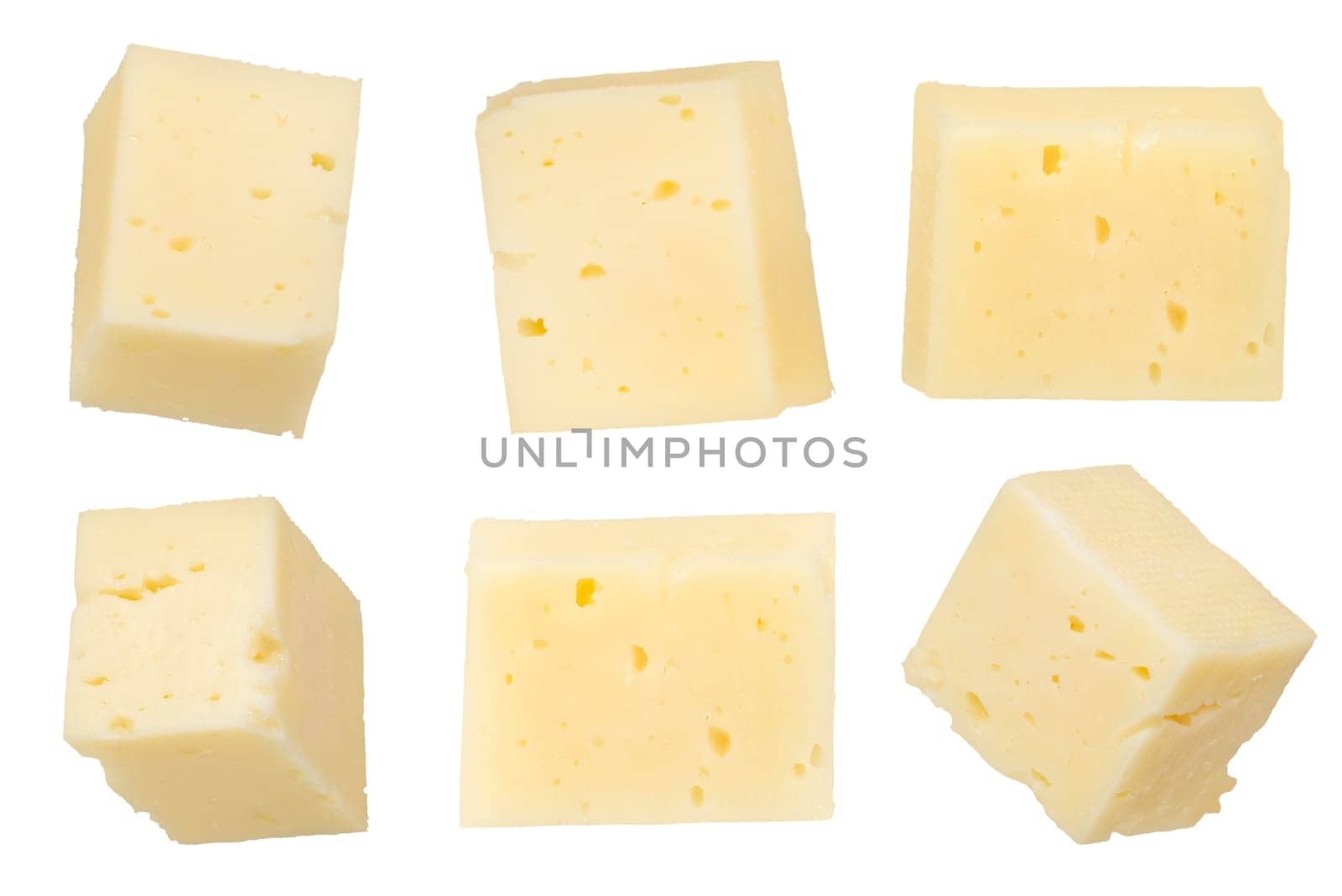 Pieces of cheese isolated on white background. Cheese for pizza. Cheese cut into squares on a white background, close-up. To insert into a design or project. High quality photo.
