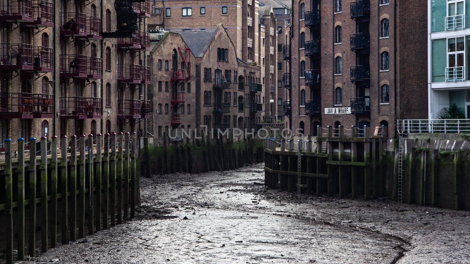 London, United Kingdom - January 27, 2007: Java wharf dried when river Thames is low. This usually nice riverside location looks sullen without water.