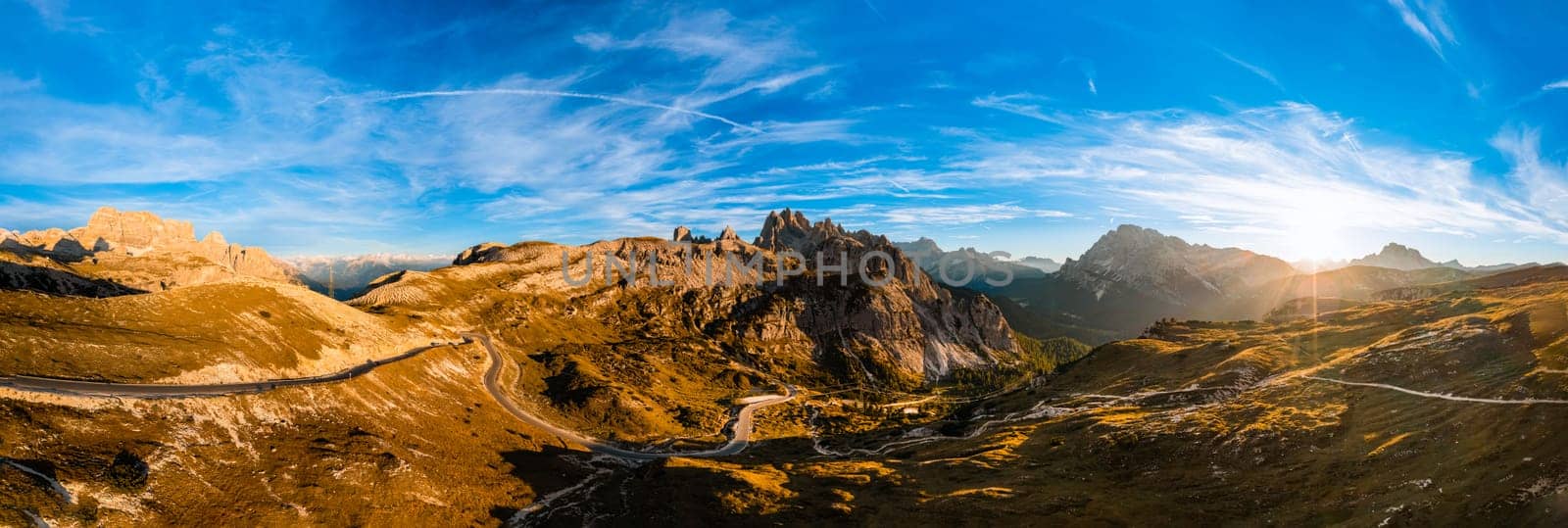 Mountains Tre Cime di Lavaredo under blue sky at sunset by vladimka