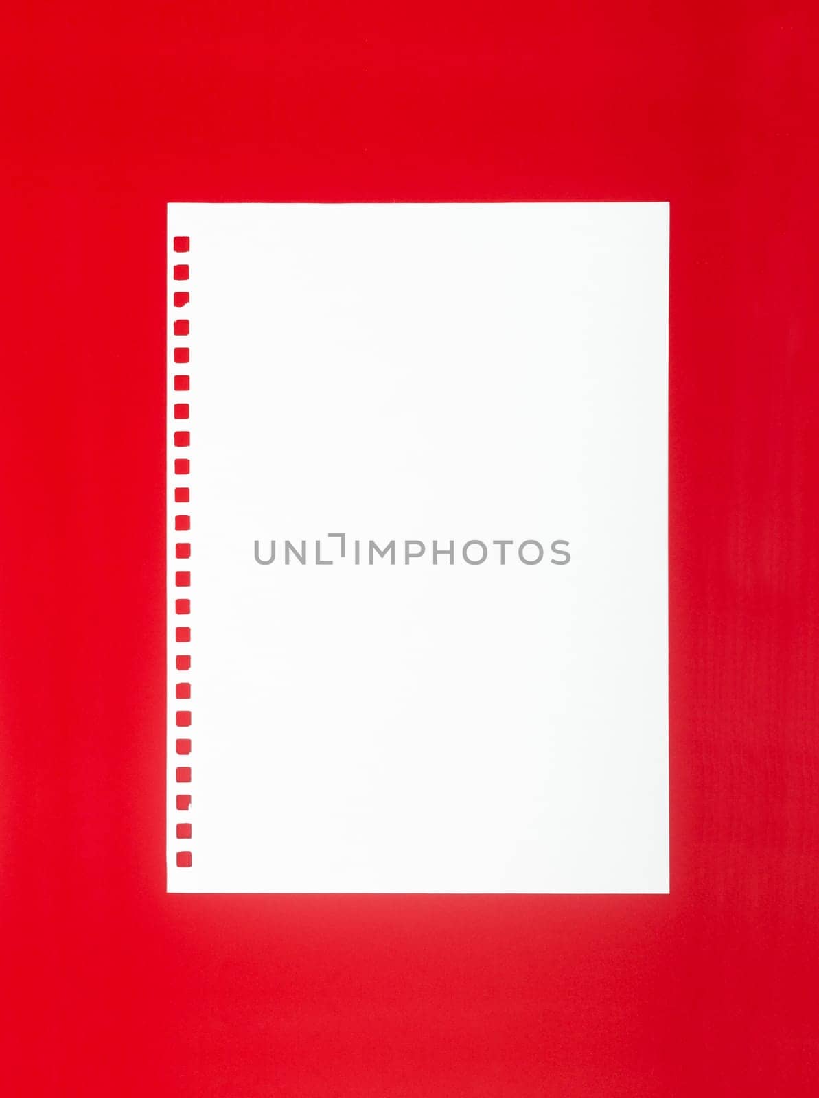 The White Blank Notepaper on Red background. by Gamjai